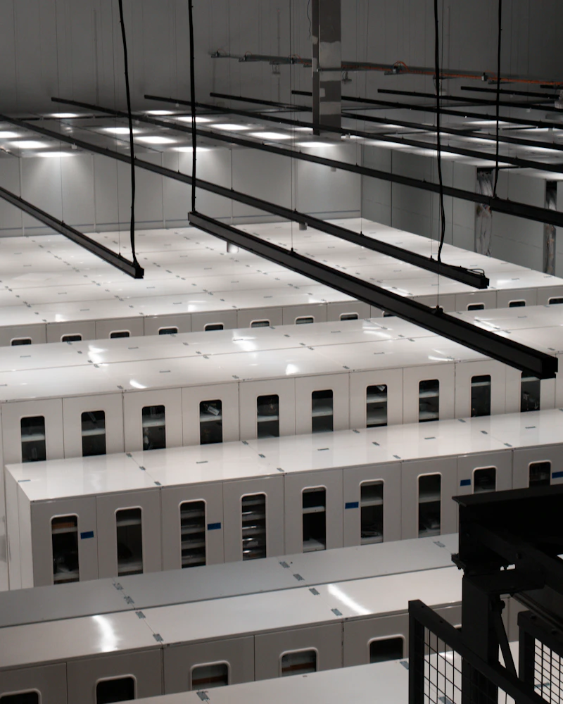 Modern data center with rows of white server cabinets