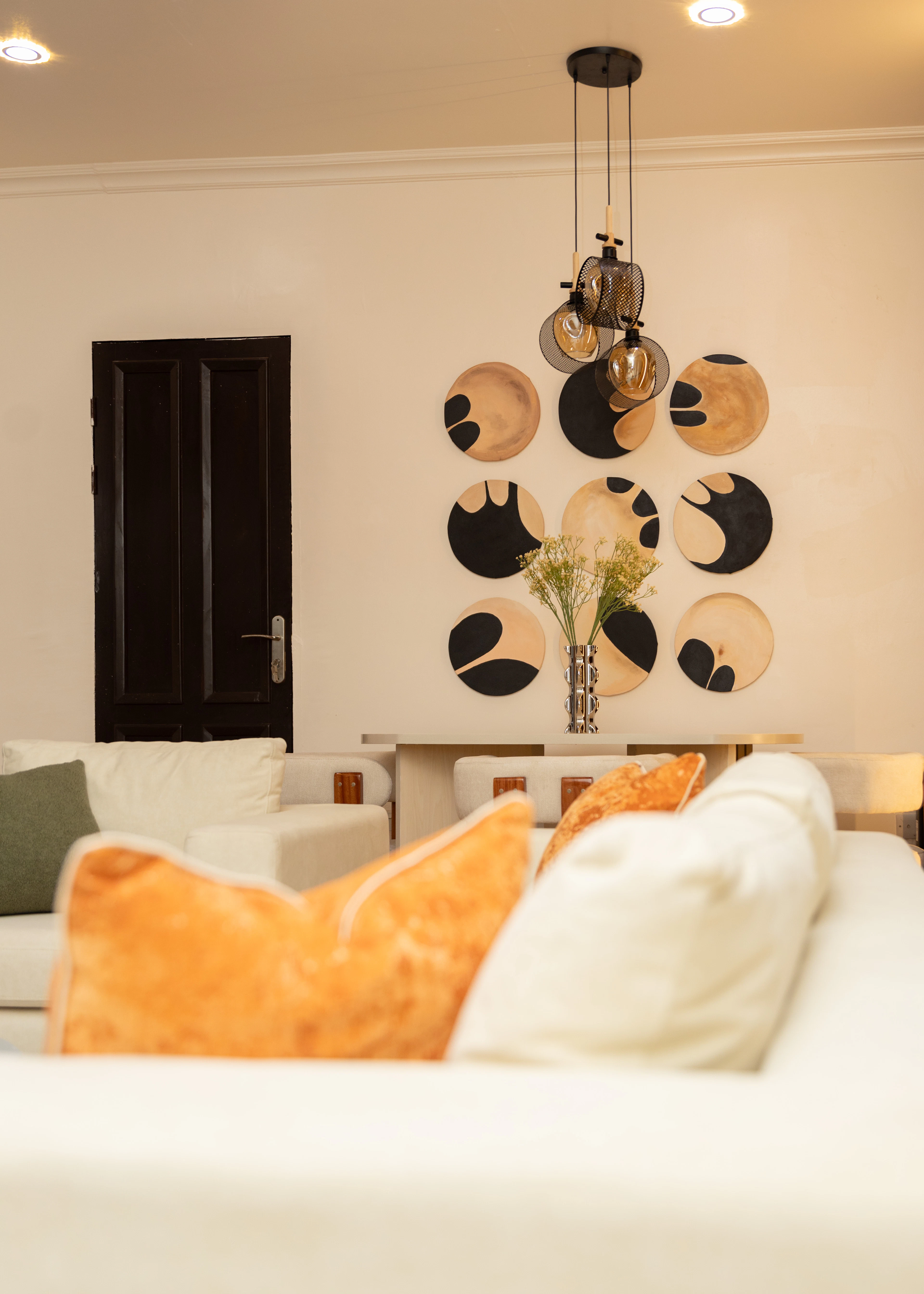 Warm living room with circular wall art