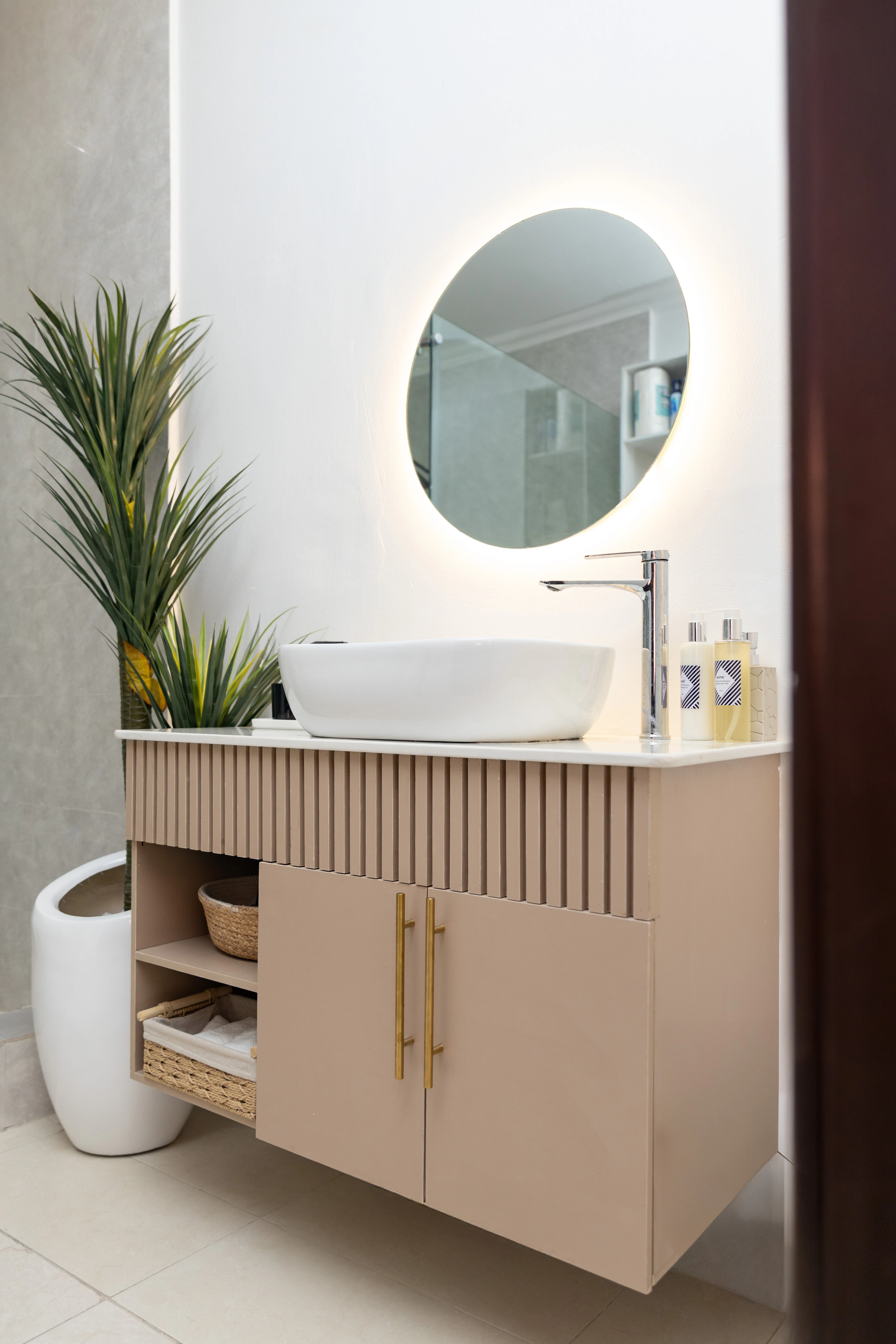 Bathroom vanity with an illuminated mirror