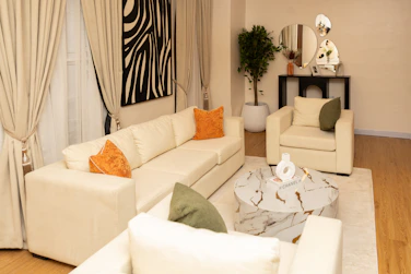 Stylish living room featuring cream furniture and contemporary decor