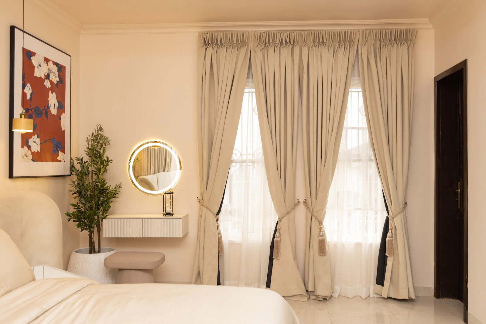 Layered lined curtain and sheer hung together at a window in a Dubai apartment, showing fabric fullness