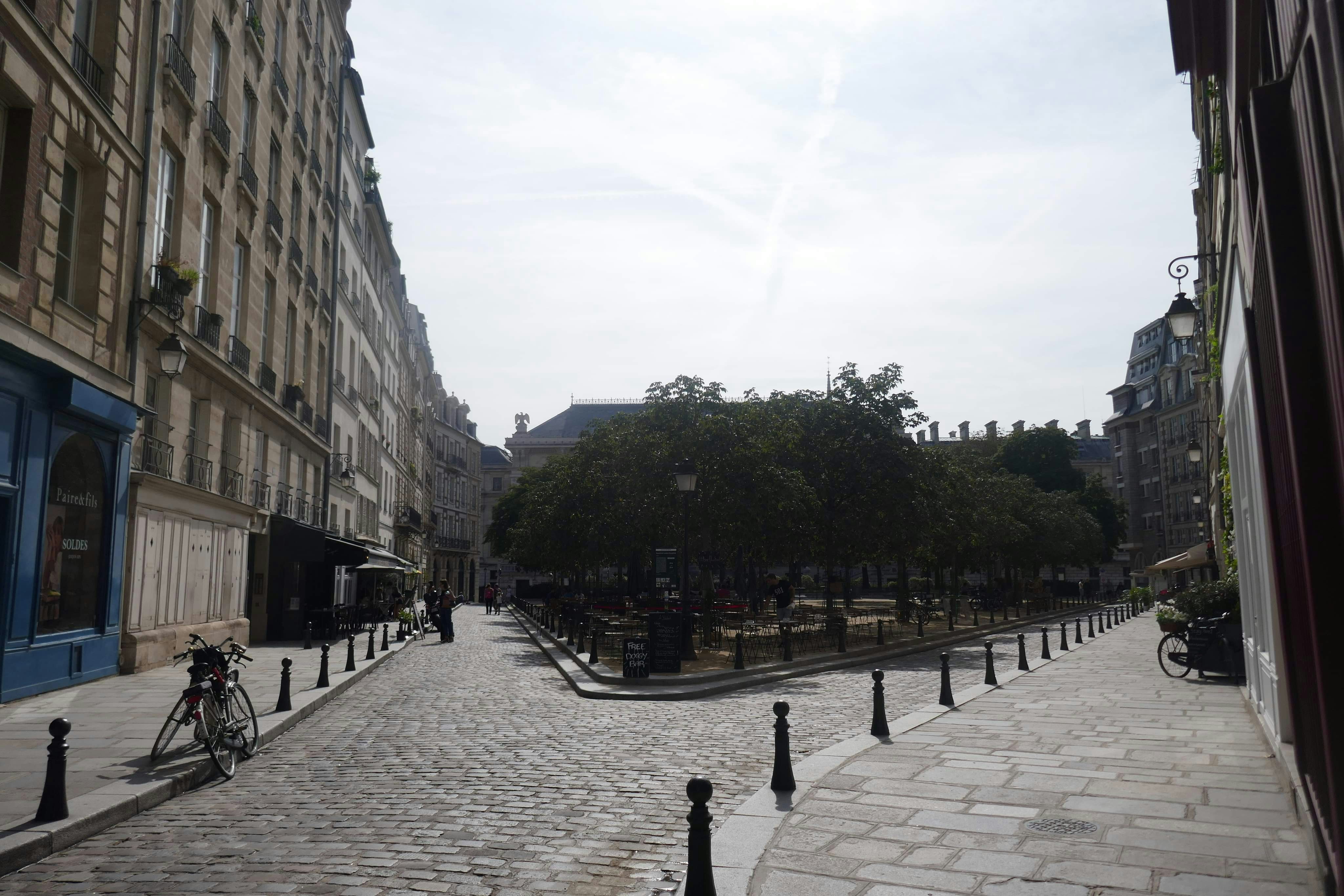 Cobblestone square in a Normandy town, the kind of base for day trips to Mont-Saint-Michel and the D-Day beaches