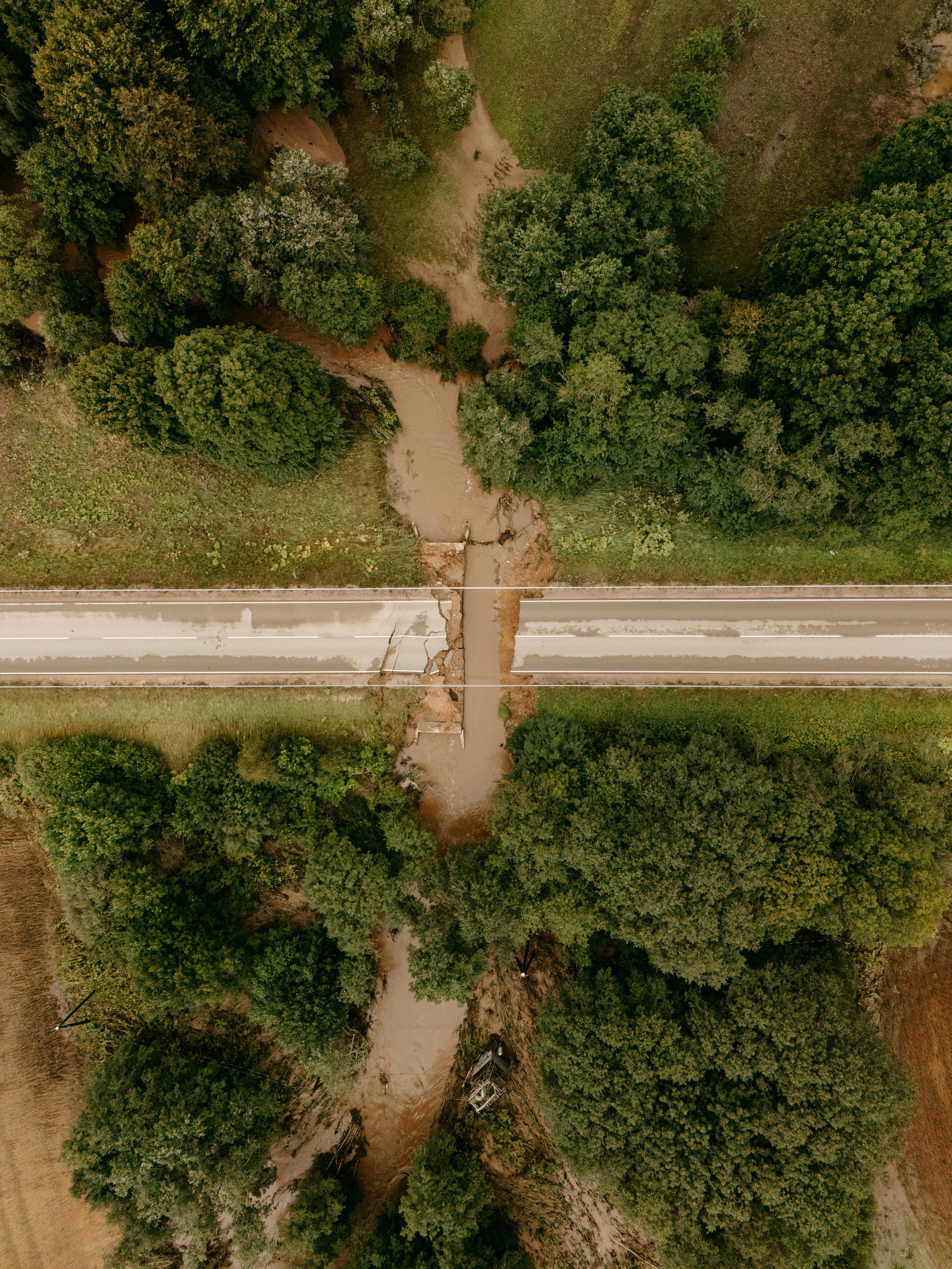 Aerial view of a road damaged by a muddy flood