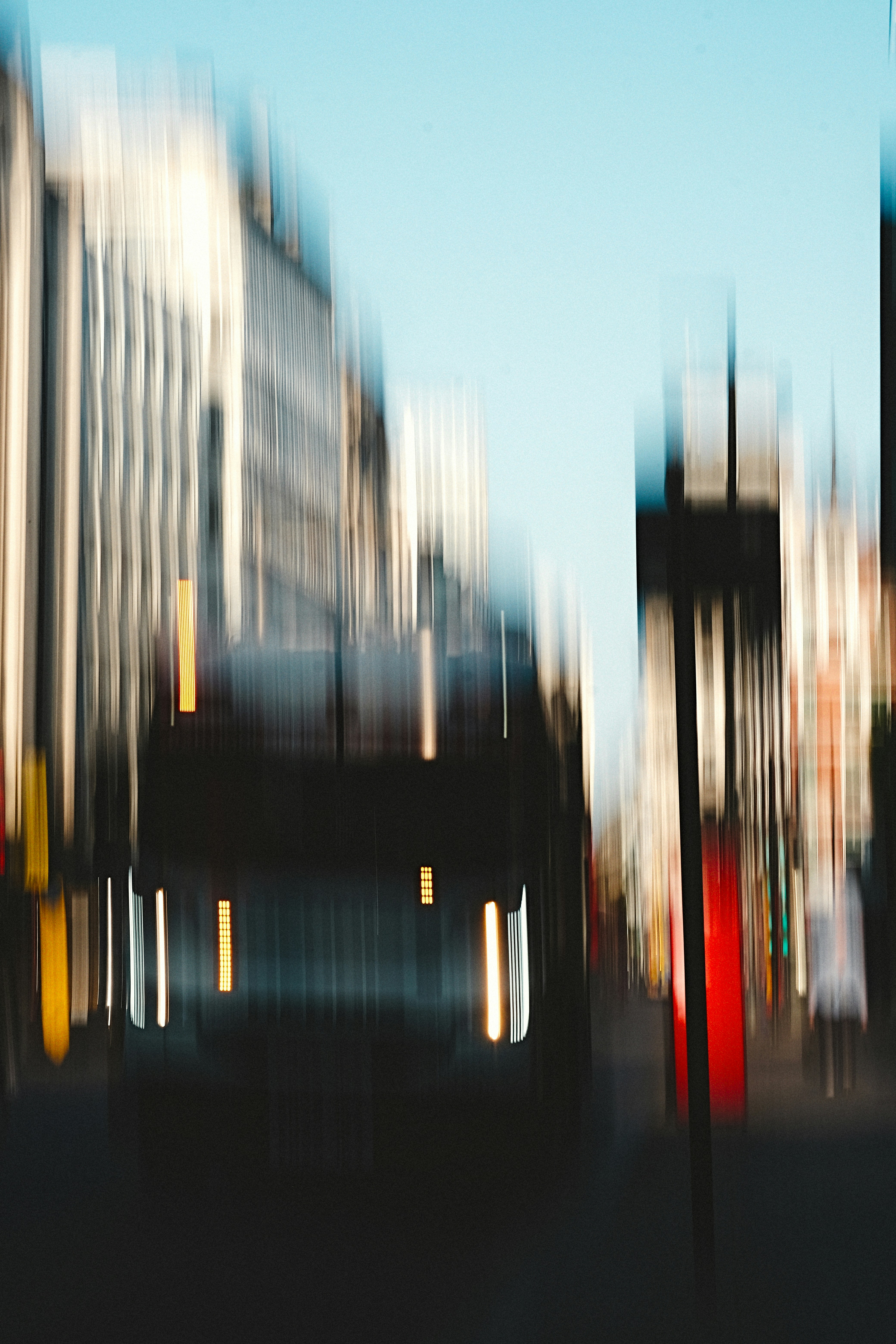 Motion blur of a bus on a city street.