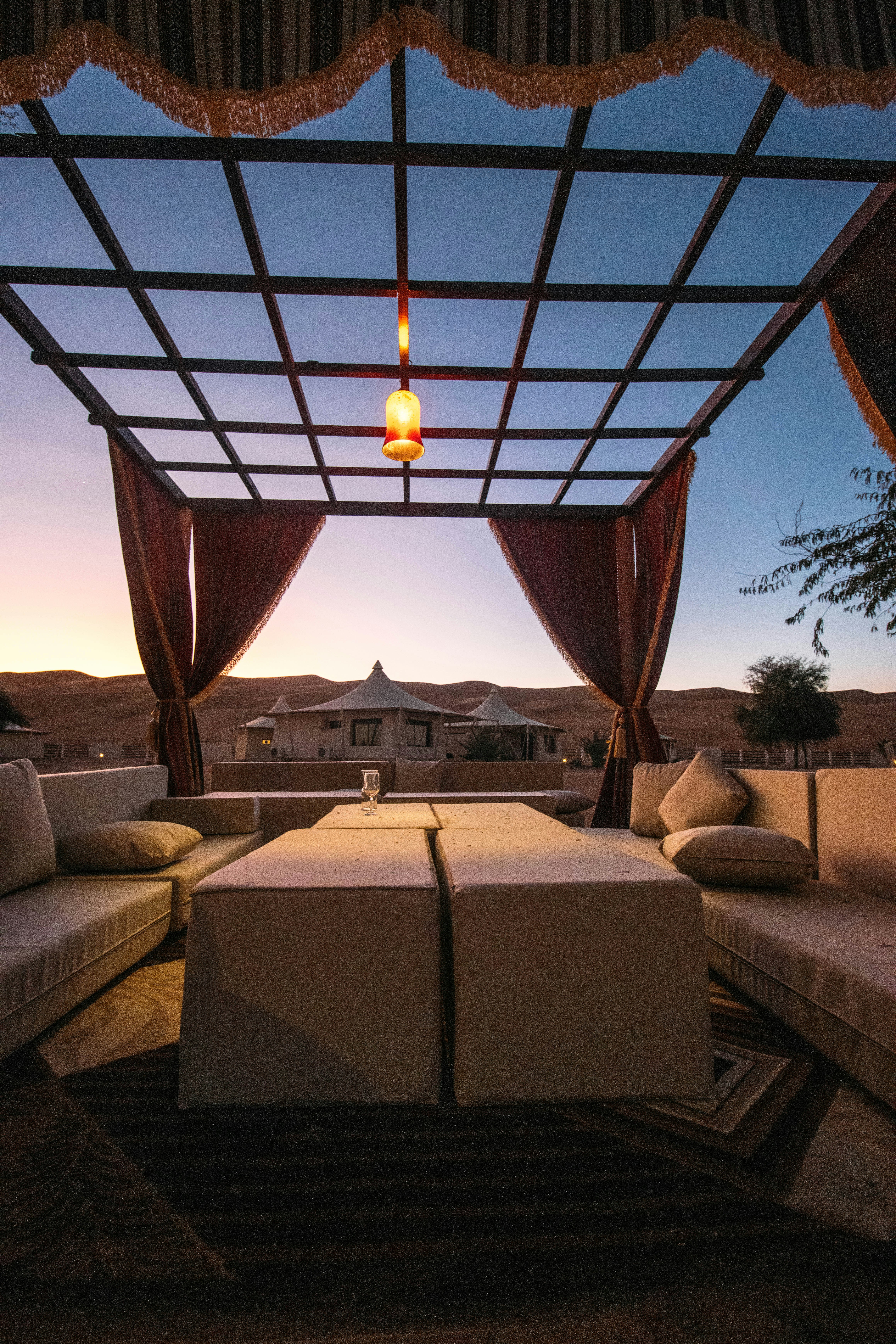 Canopy lounge with cushions at sunset