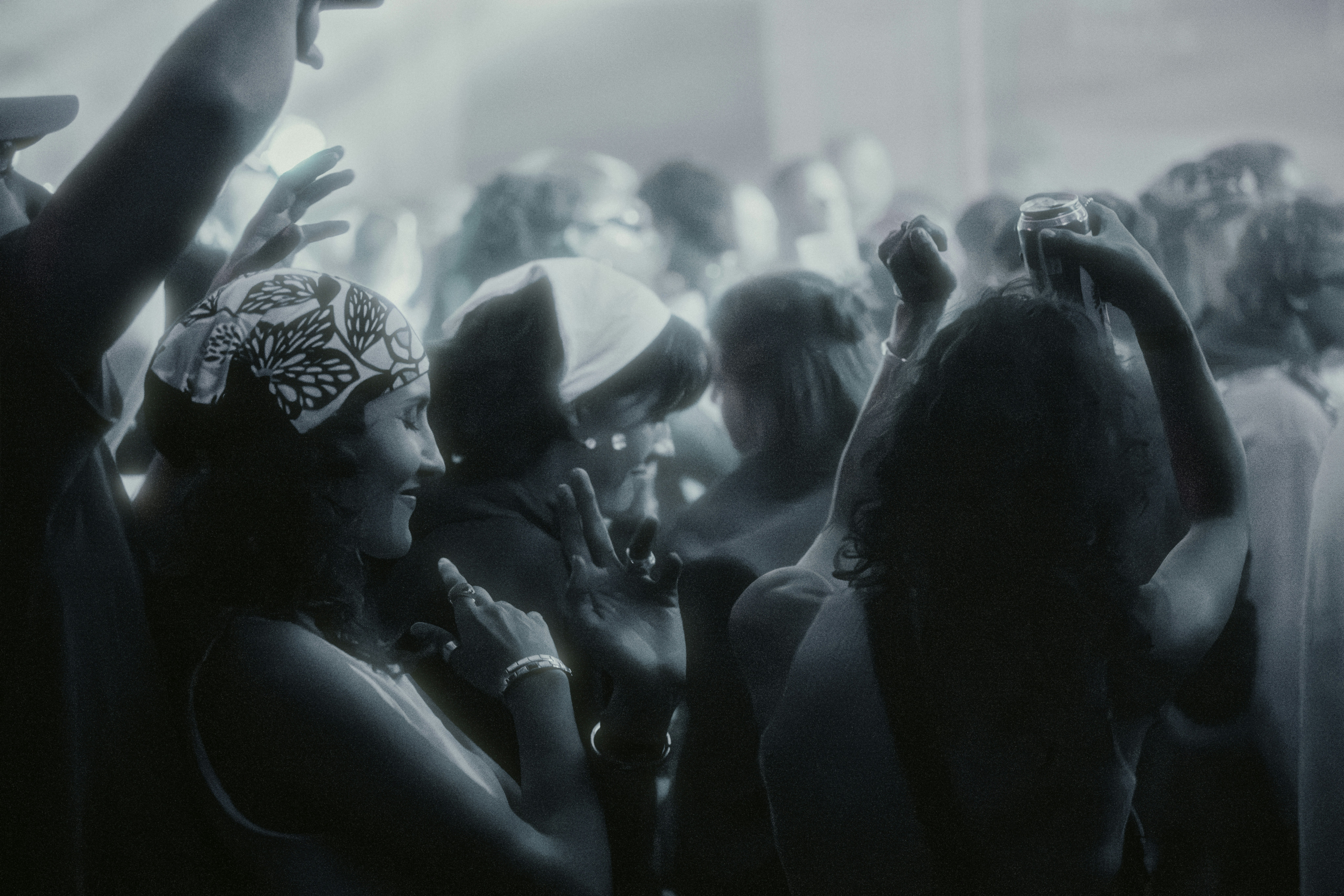 A crowd of people dancing and enjoying a lively concert.