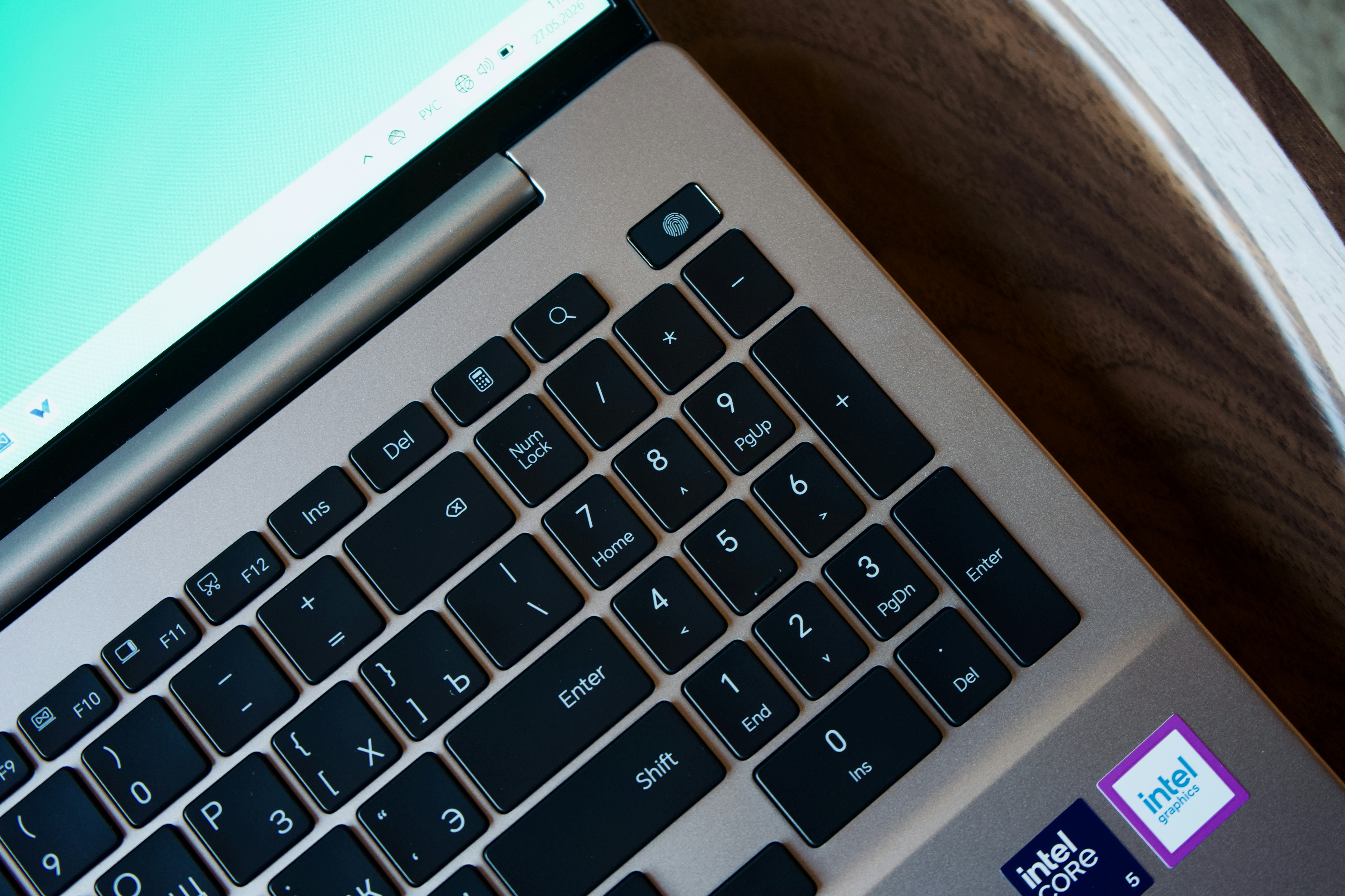 Laptop keyboard and screen with intel stickers.