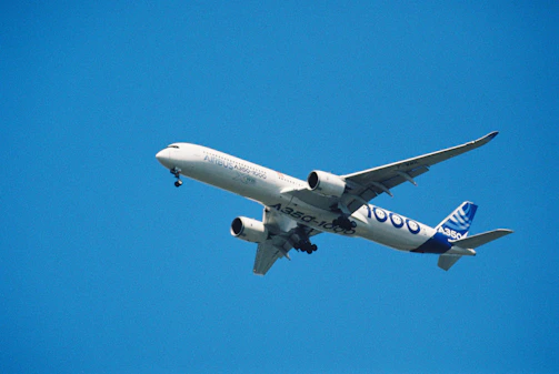 Airbus a350-1000 passenger jet flying against blue sky