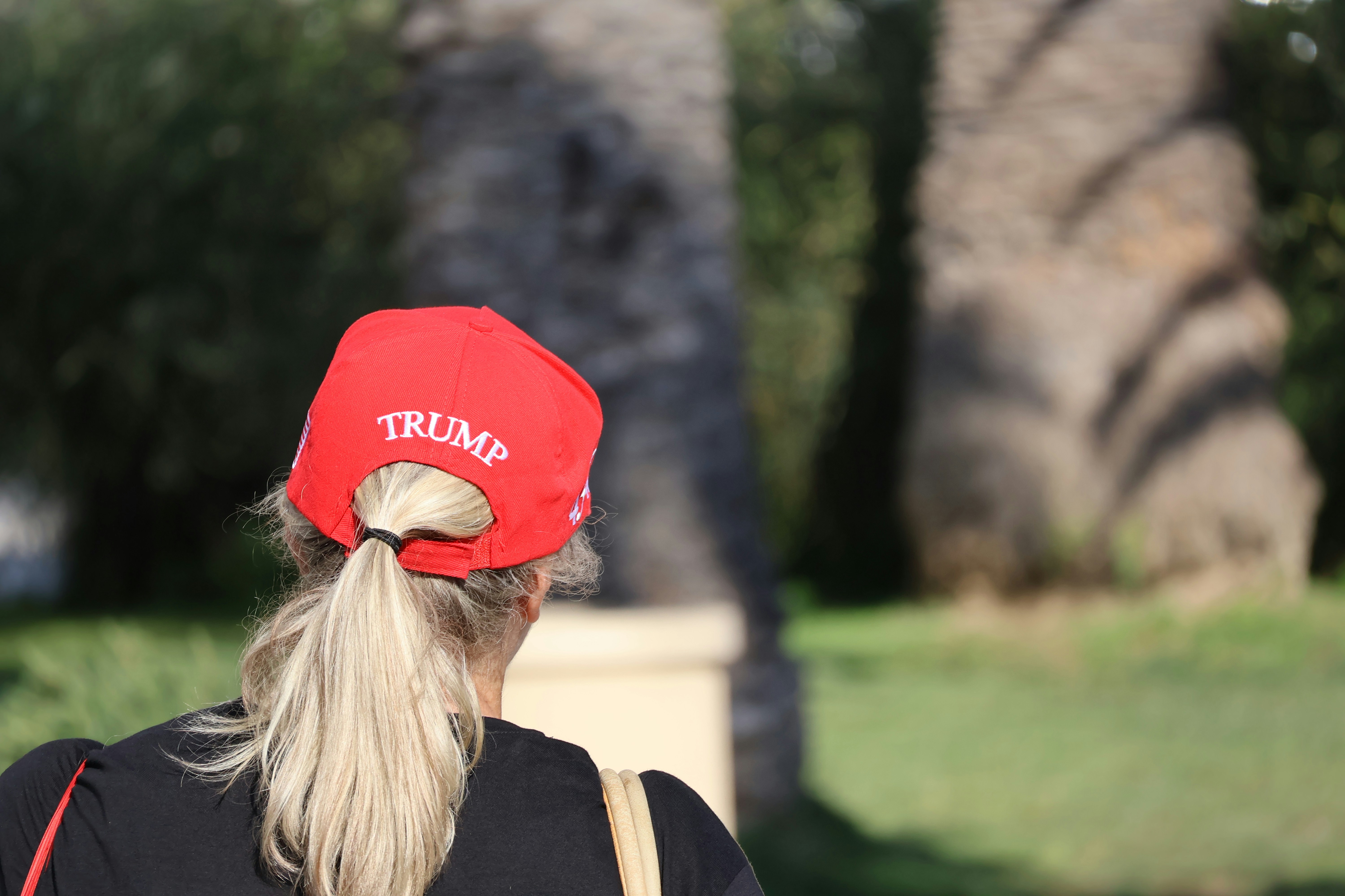 Trump Throws His Hat, Woman Refuses To Give It Up