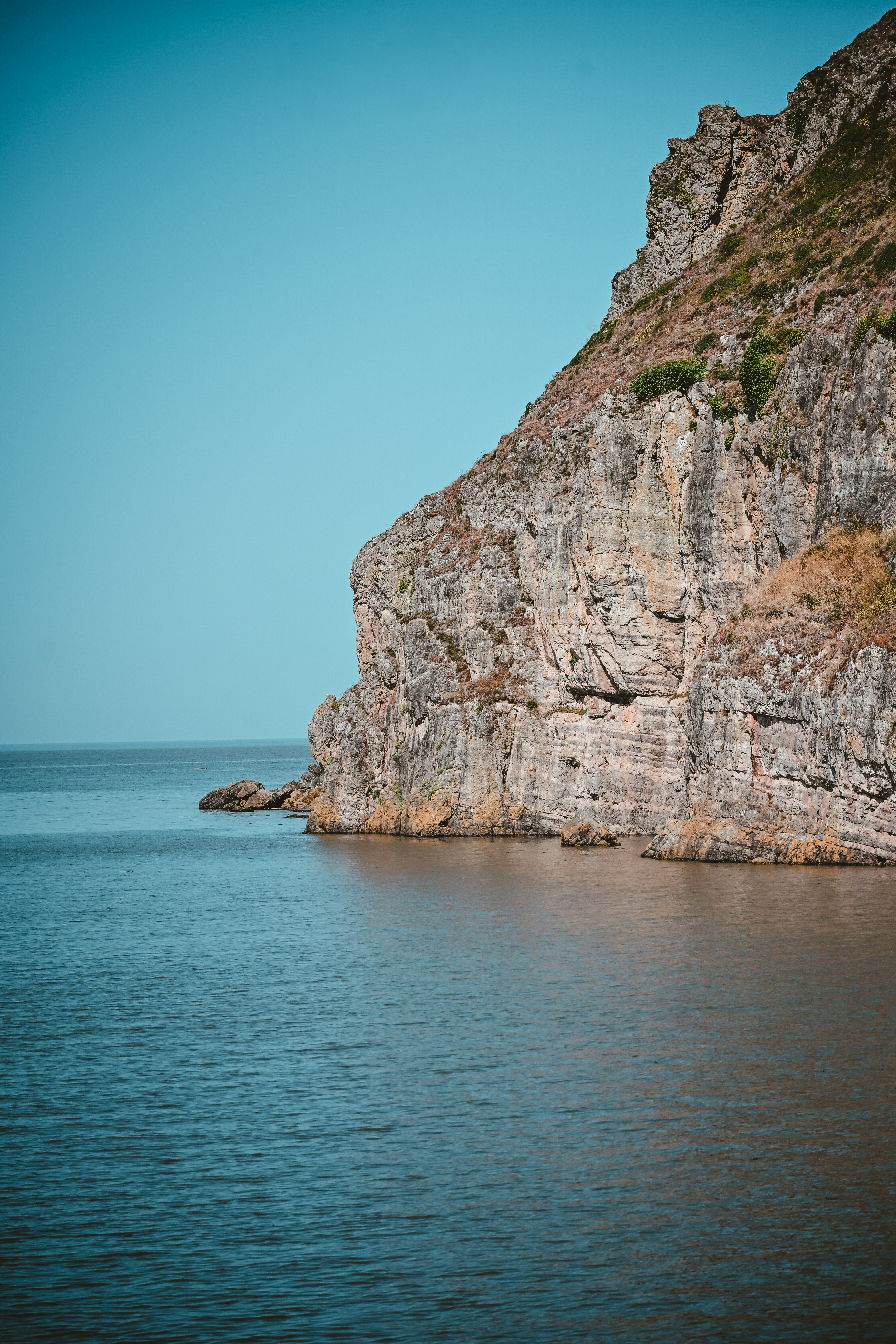 Brean down meets the ocean under a clear sky