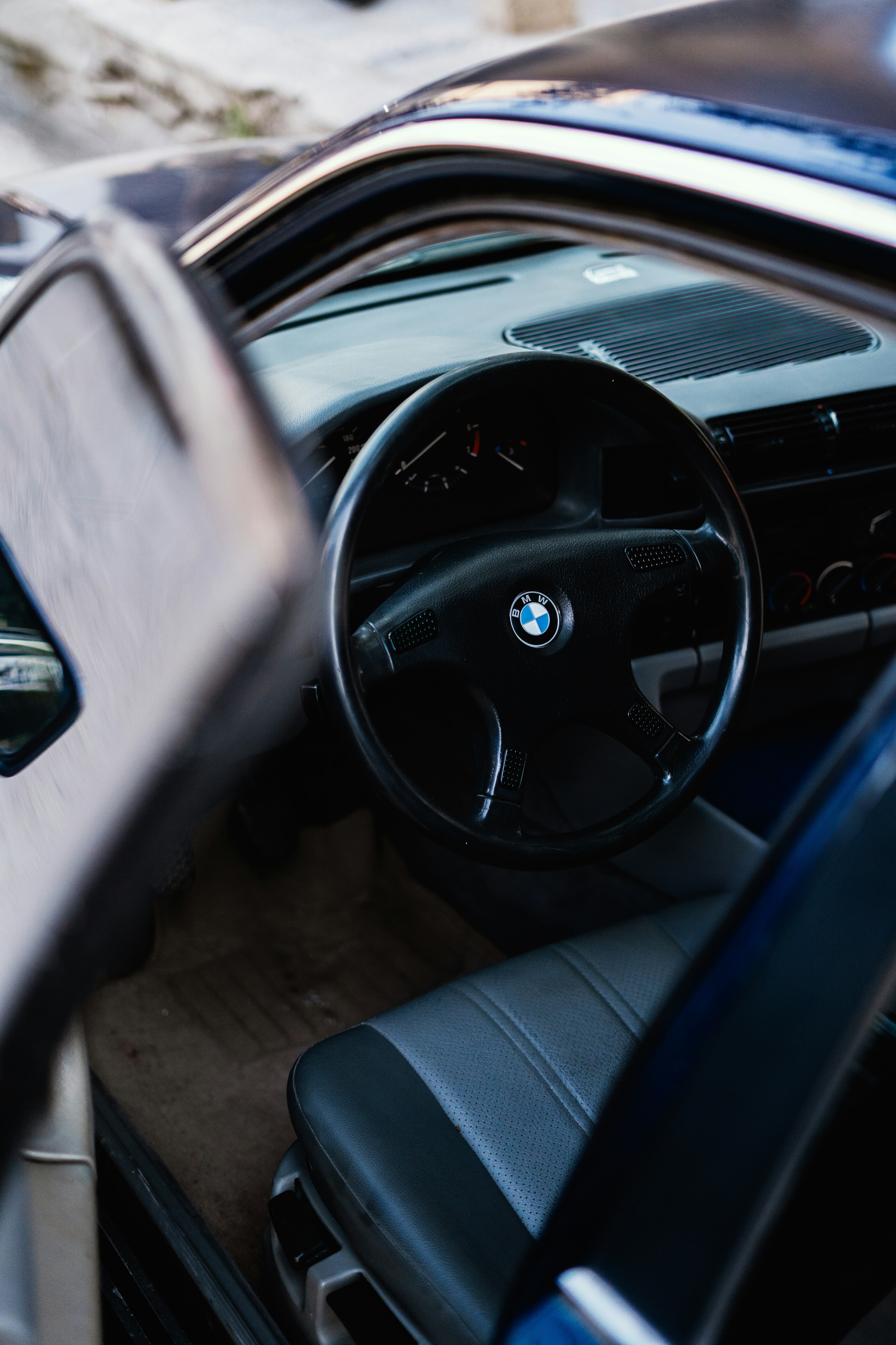 Interior view of a classic BMW car with open door