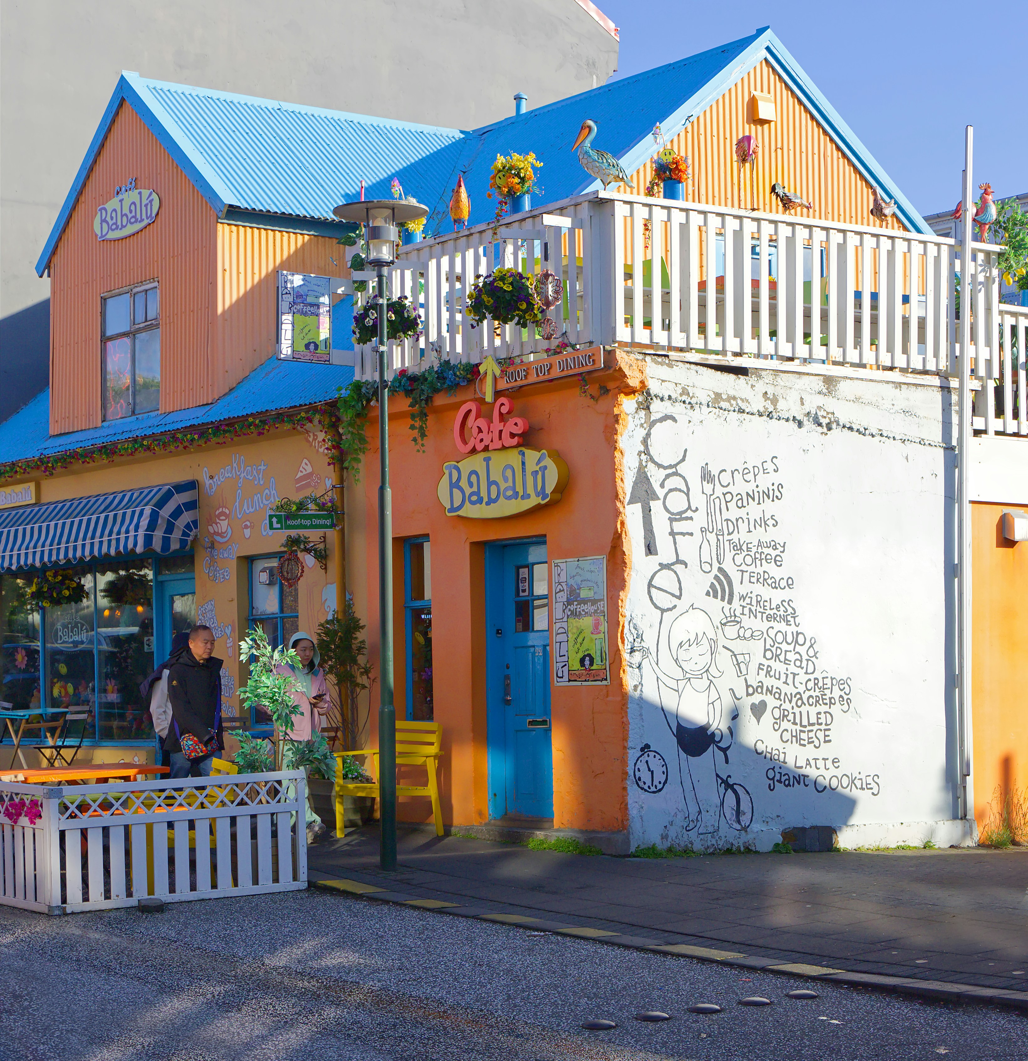 Colorful cafe babalú building with outdoor seating.