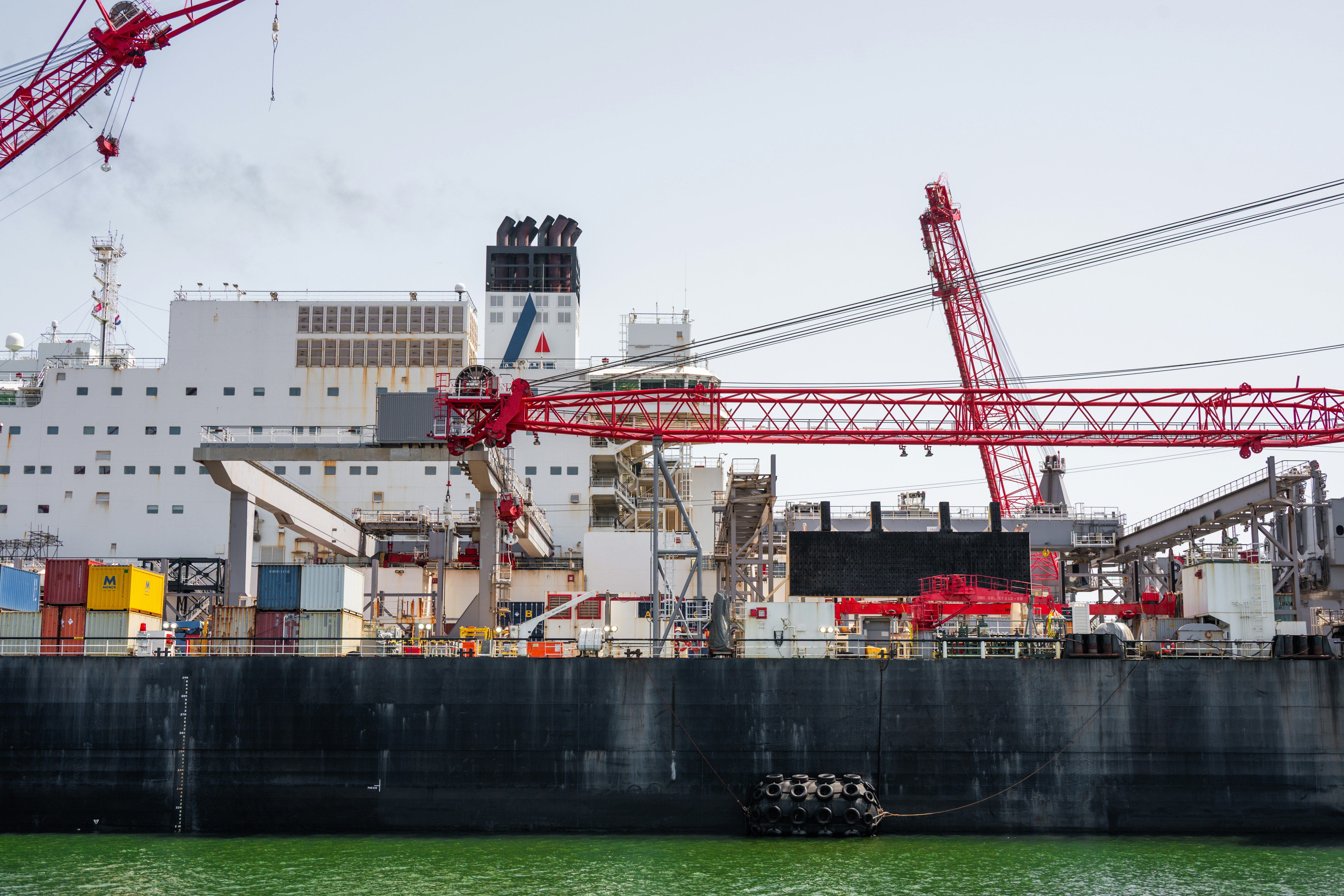 large LNG tanker under construction in shipyard
