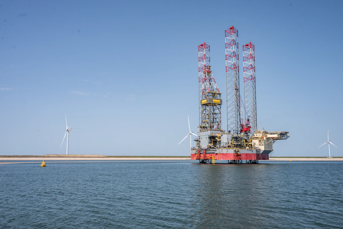 Offshore installation vessel beside wind turbines at sea
