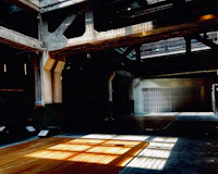 Low sun laying a bar of window light across a bare wooden floor