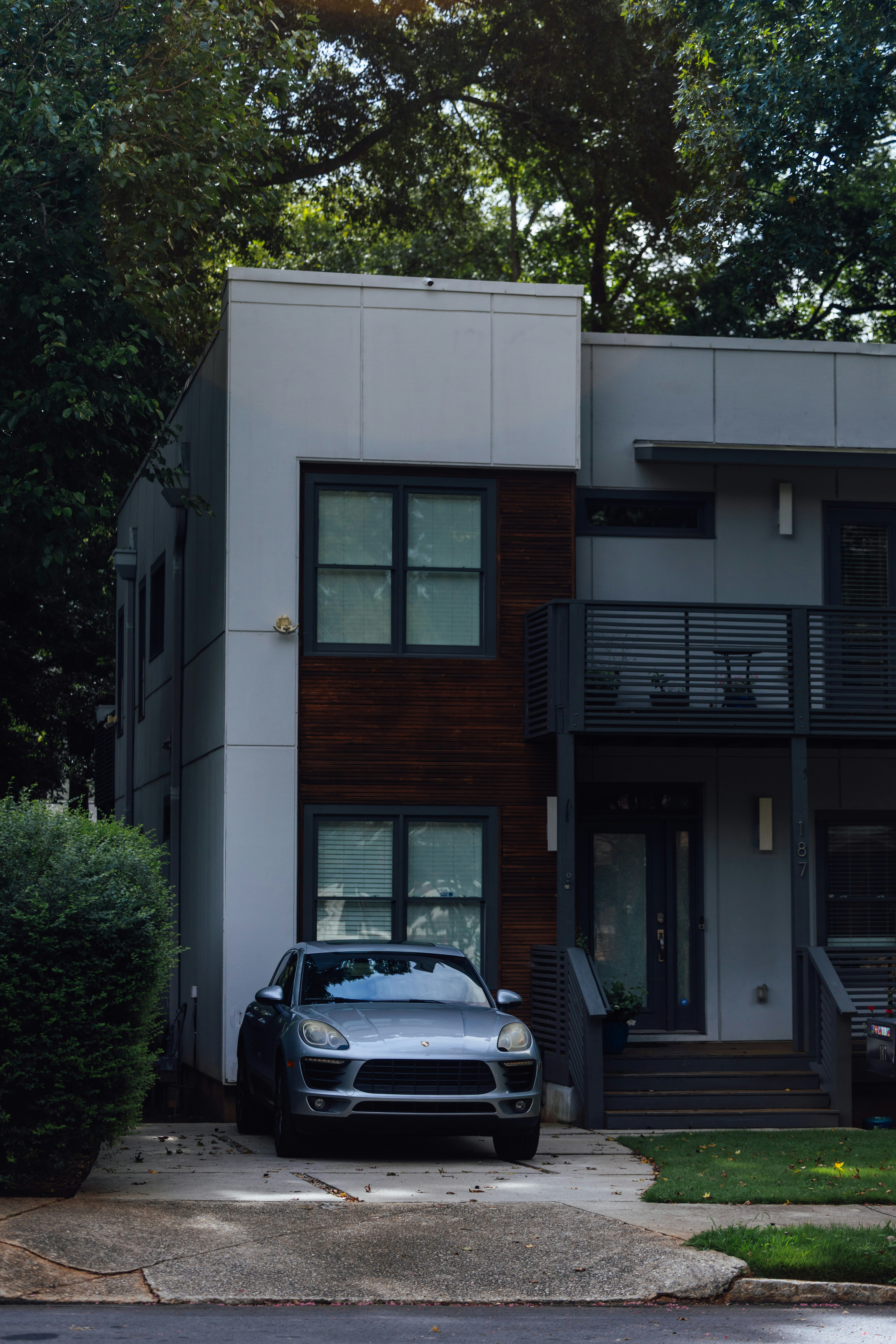 A modern house with a car parked in the driveway