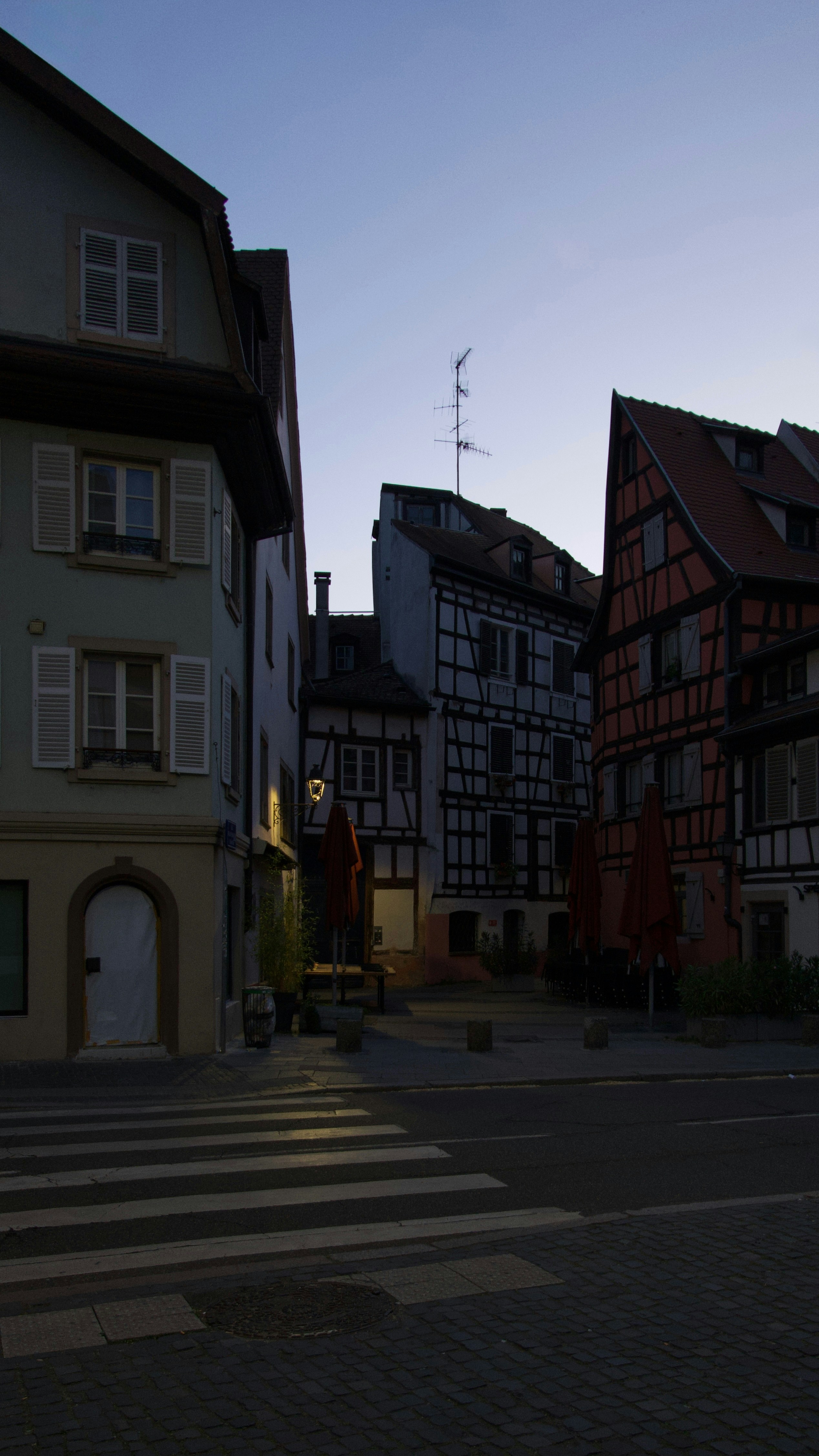 Old european town street at dusk with half-timbered buildings