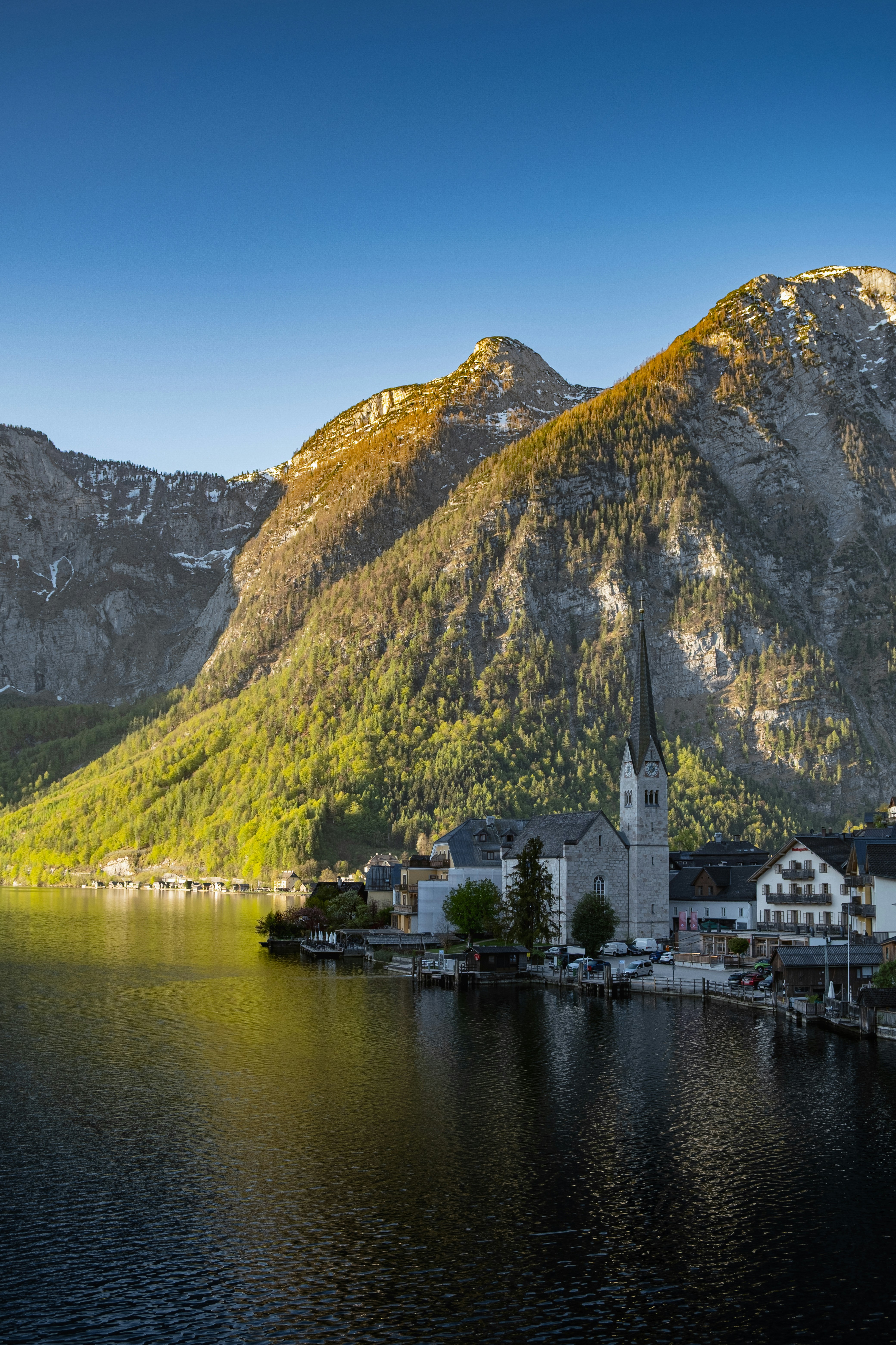 Picturesque hallstatt village by a lake with towering mountains