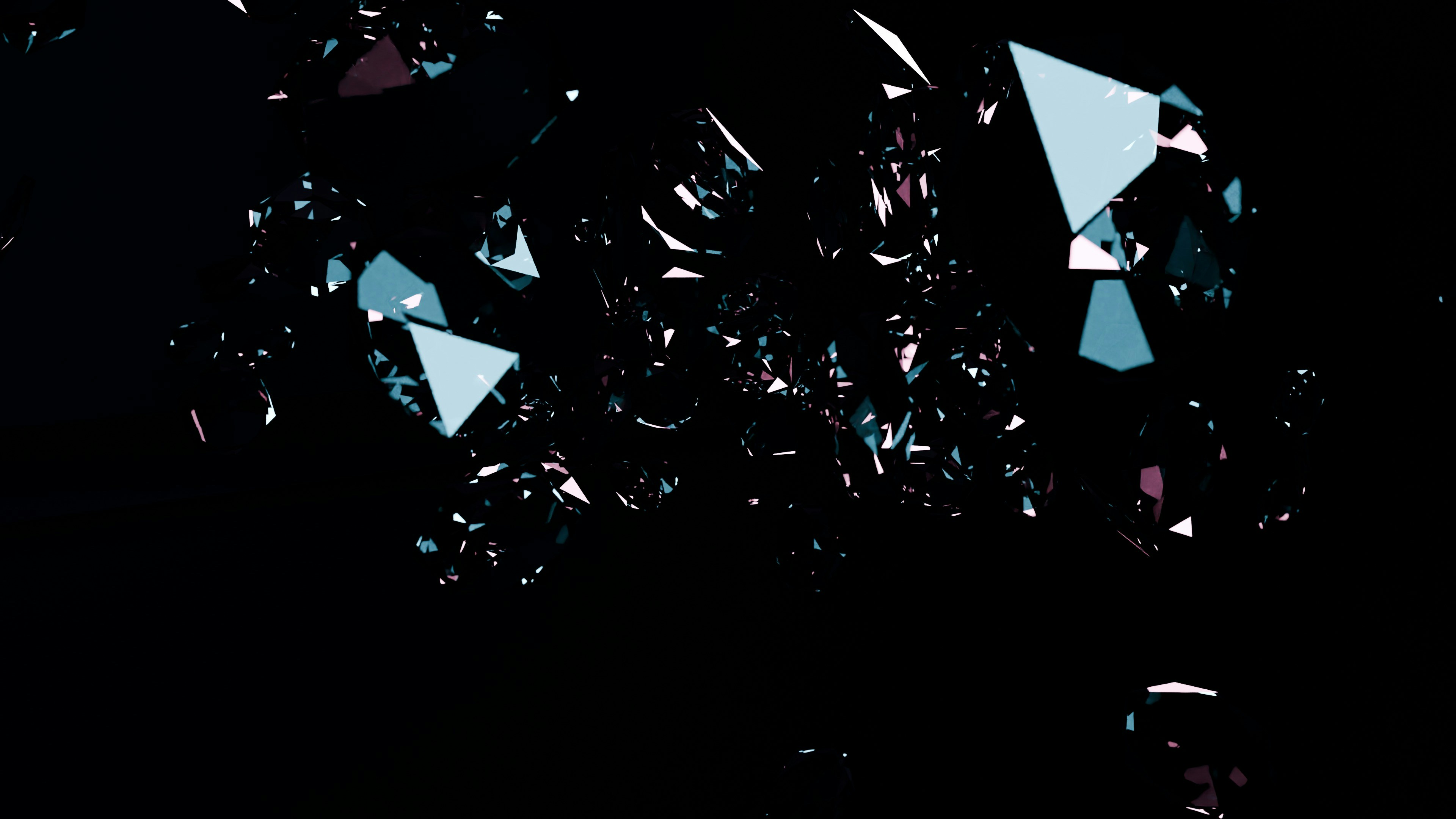 Shattered glass fragments with blue and pink reflections on black