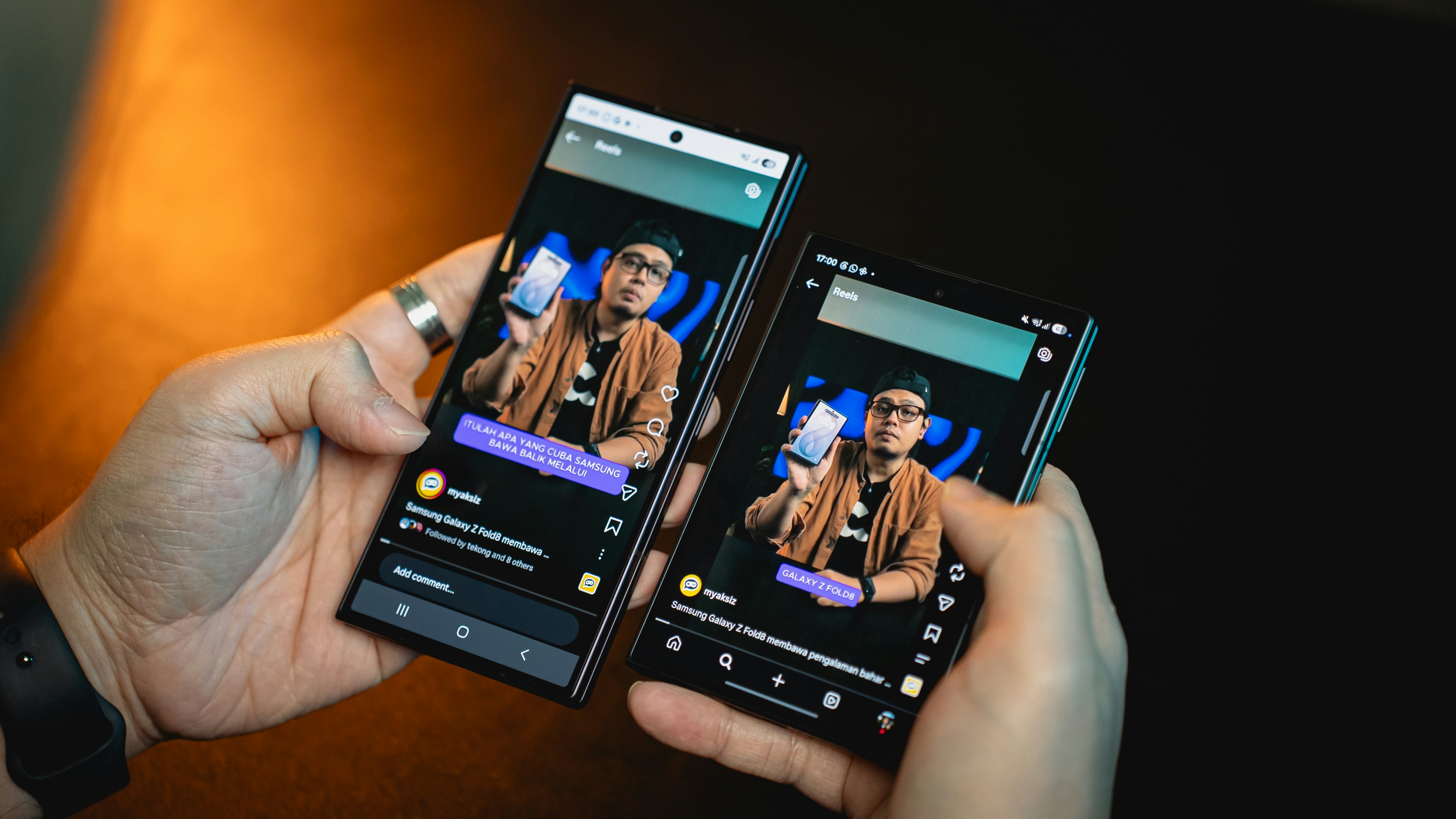 hands holding sleek dark titanium smartphone split screen view multitasking