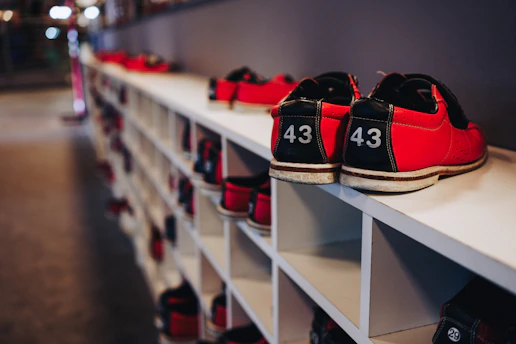 Red bowling shoes with number 43 on a white rack