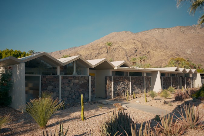 Single-story desert home with mountains behind it, the kind of property the Southern Nevada median price describes