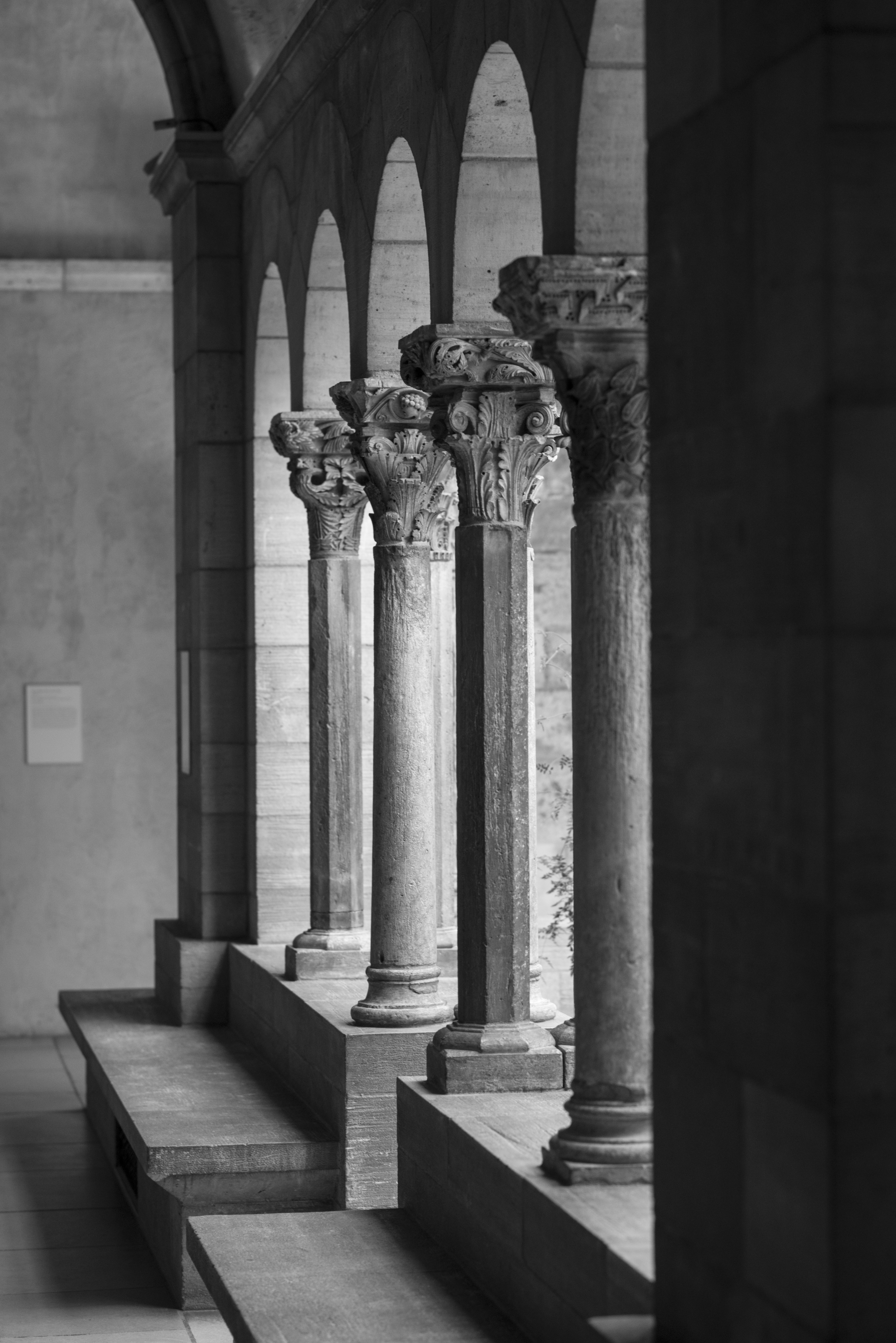 Black and white view of ornate stone columns and arches
