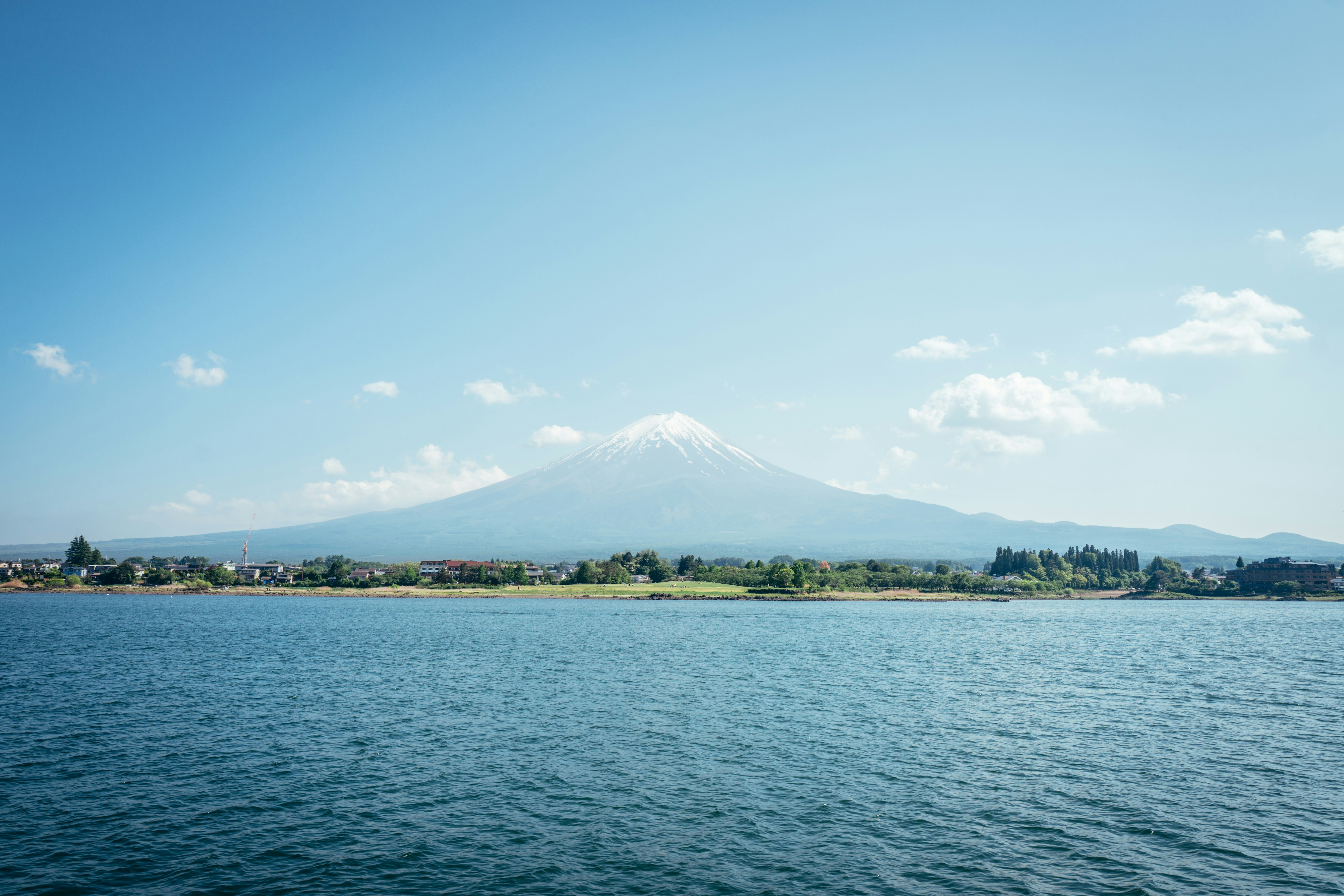 Mount fuji rises majestically behind a calm lake