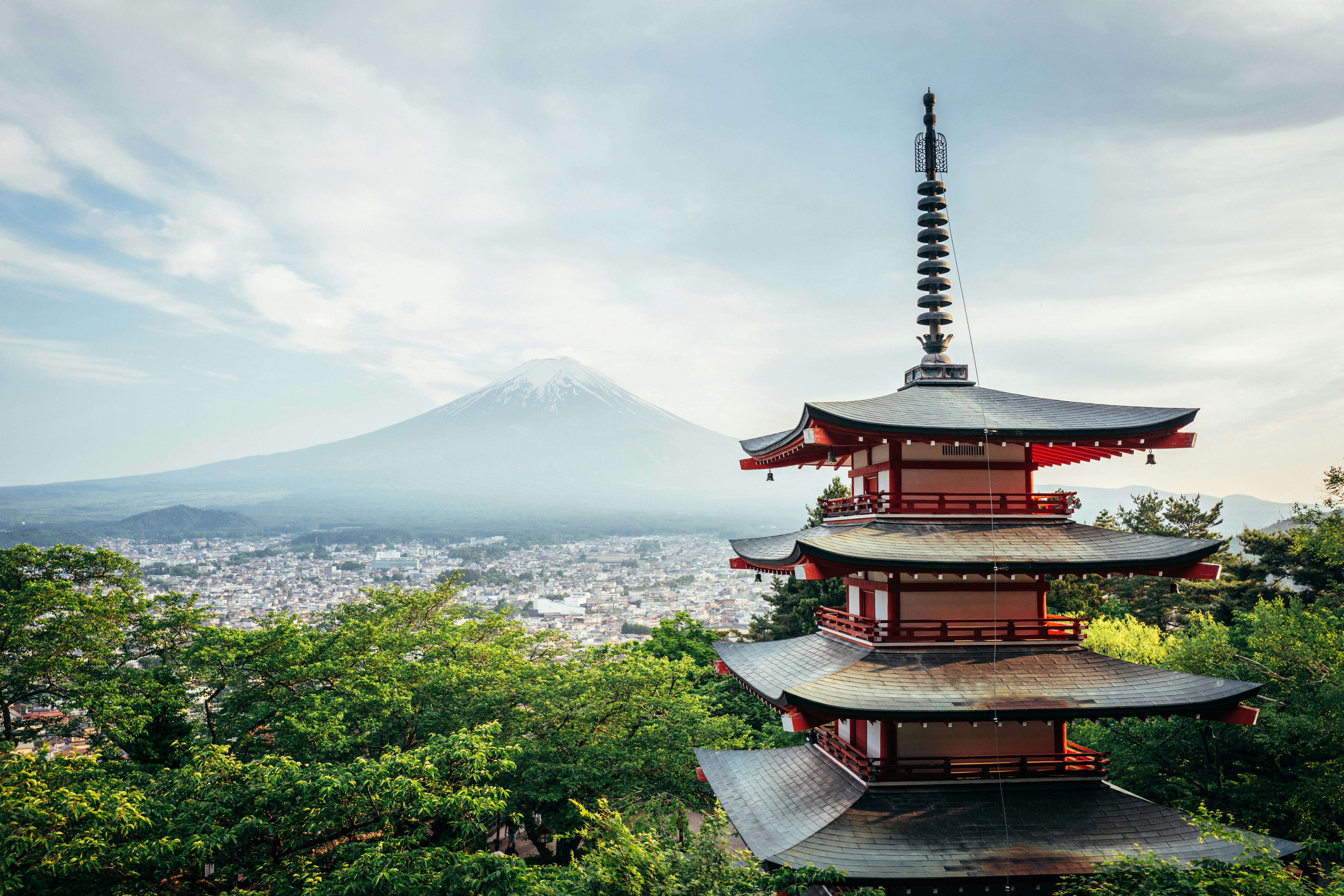 Iconic red pagoda with mount fuji and city view
