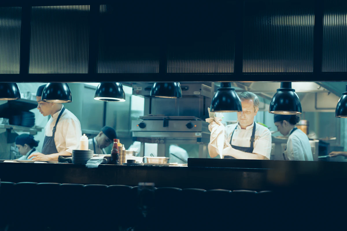 Chefs preparing food in a professional kitchen
