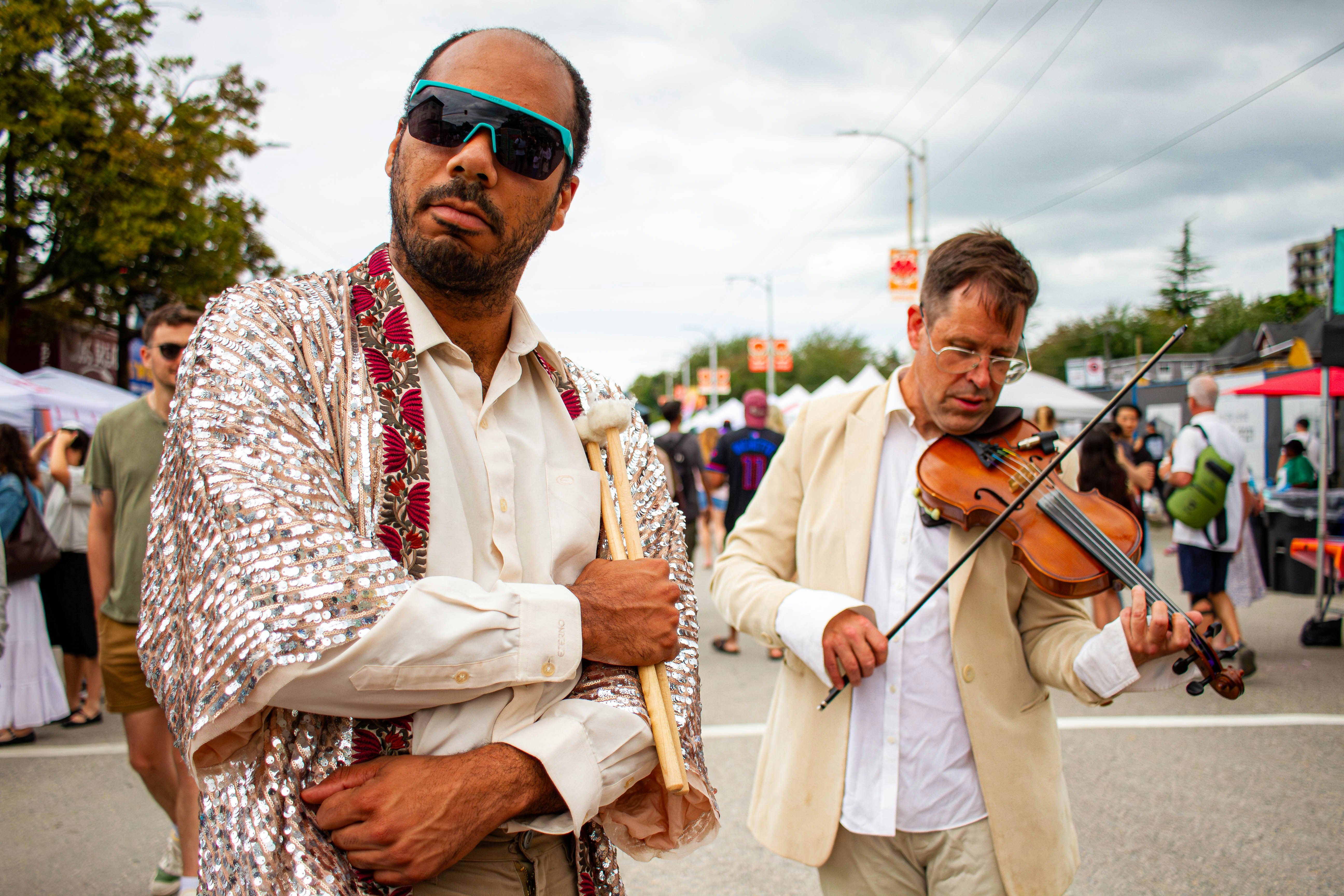 Violinist performing live on a festival stage