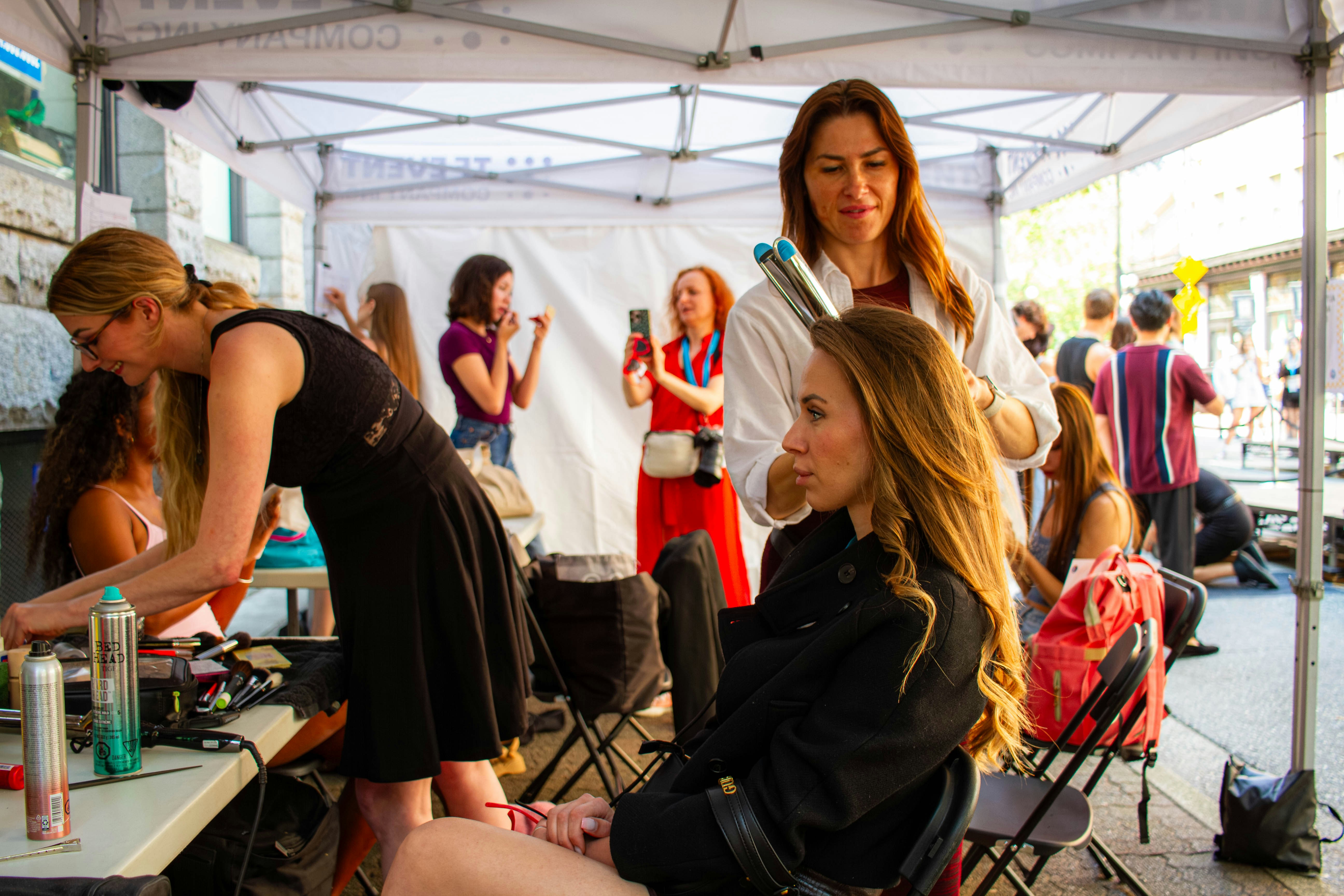 Beauty stylist preparing makeup and styling tools in a salon