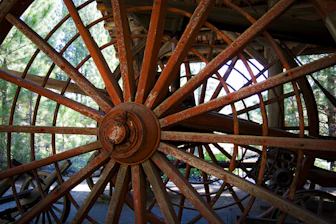 Rusty wooden wheels with many spokes