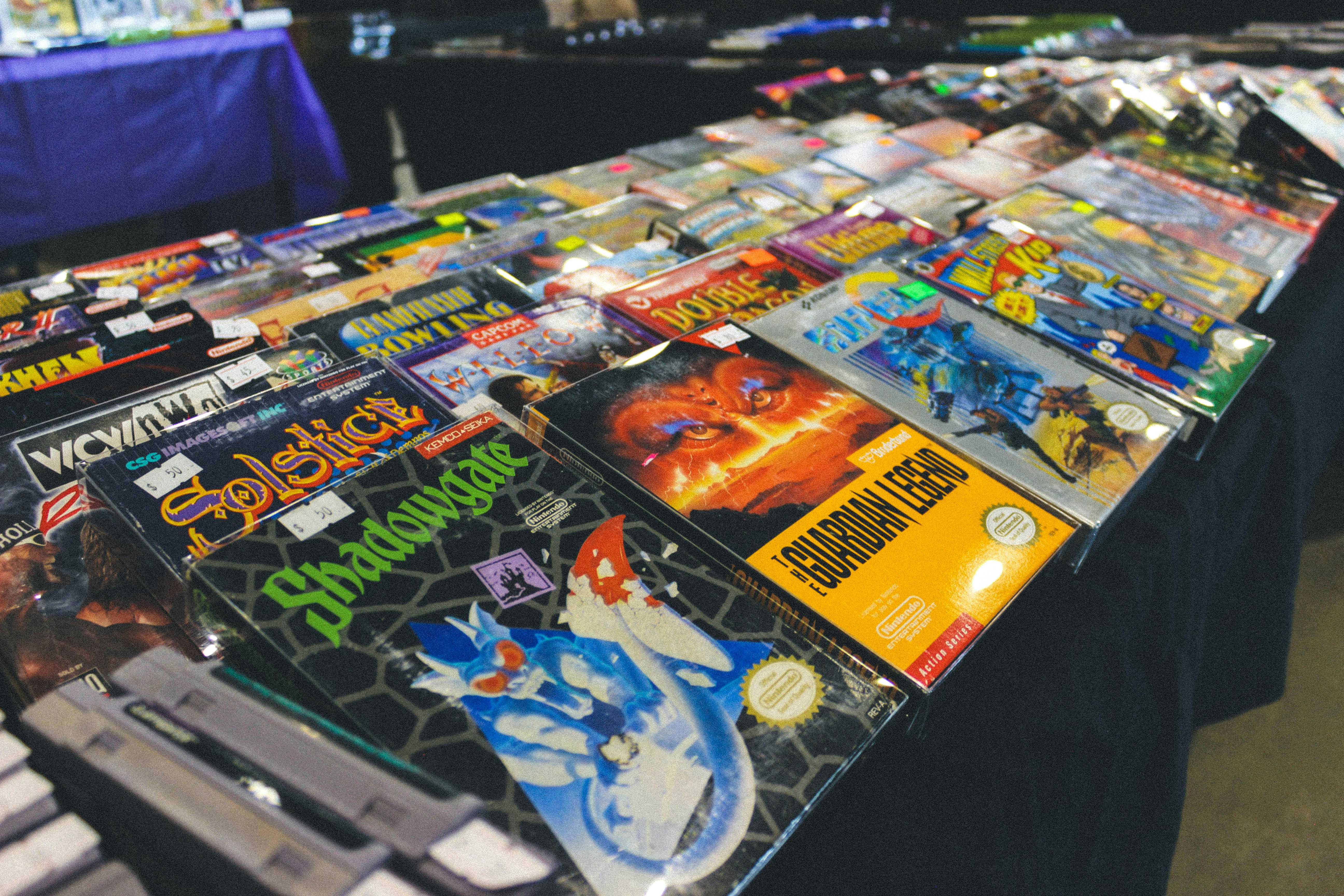 Numerous vintage video game cartridges displayed on a table
