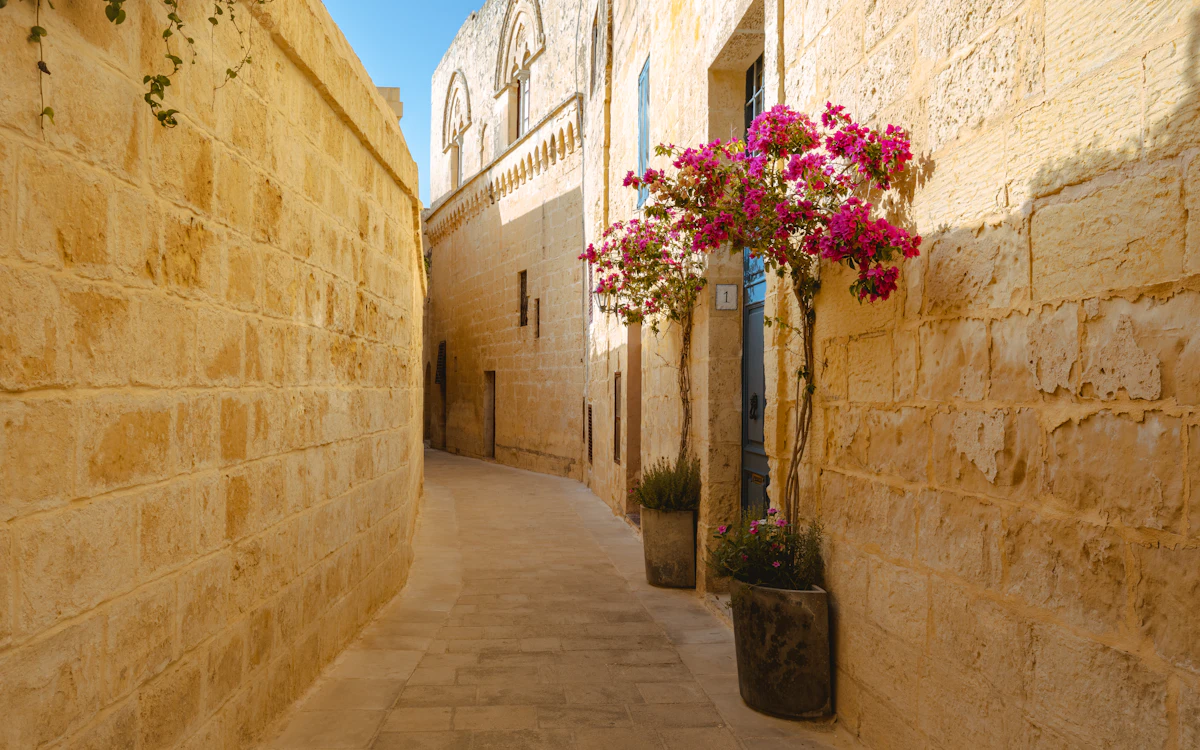 Narrow limestone alley in Mdina, Malta's Silent City