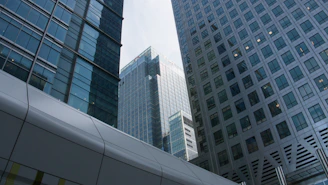 Modern glass and steel skyscrapers with a walkway