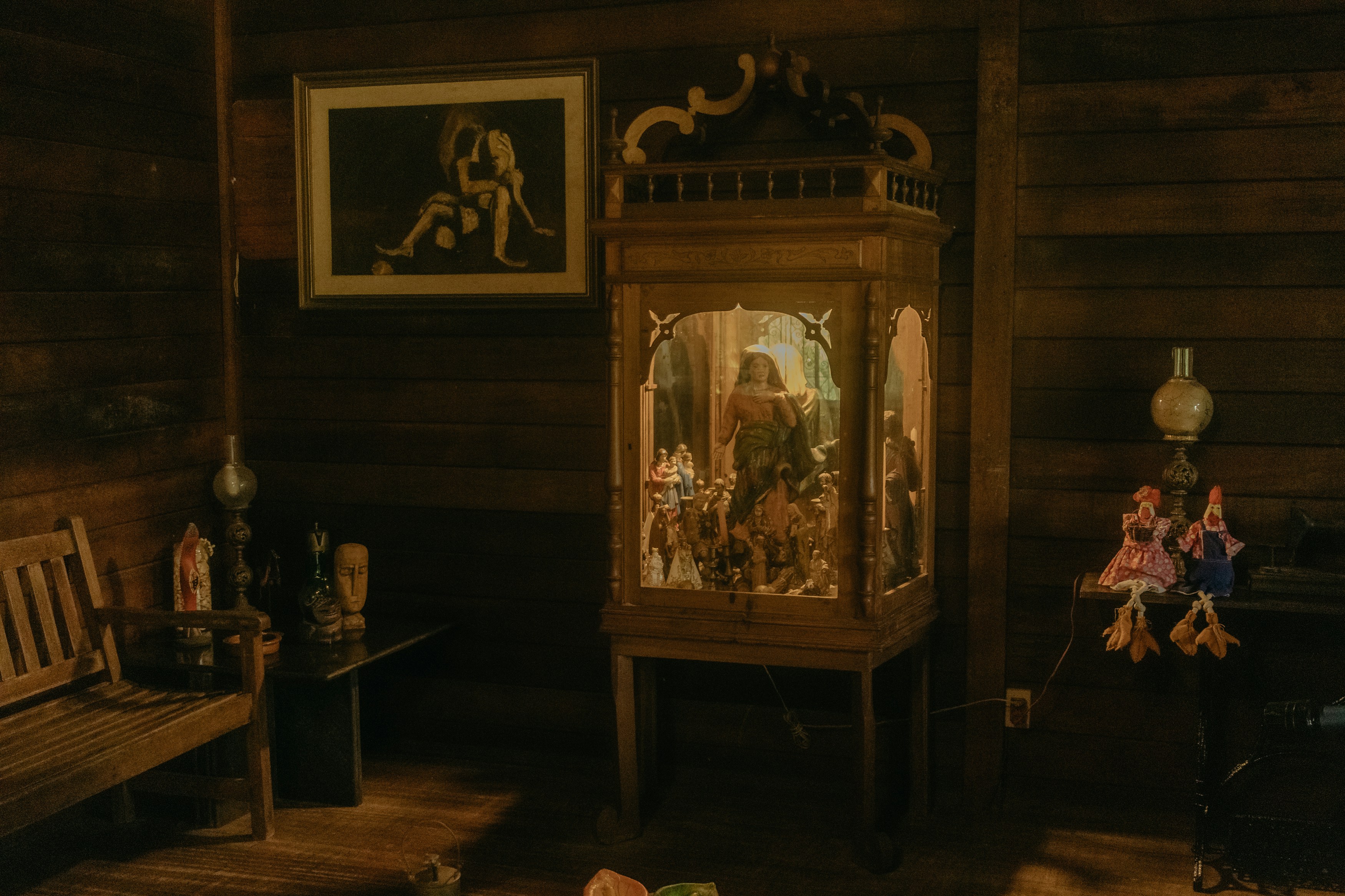 Traditional wooden cabinet and framed art in wooden interior
