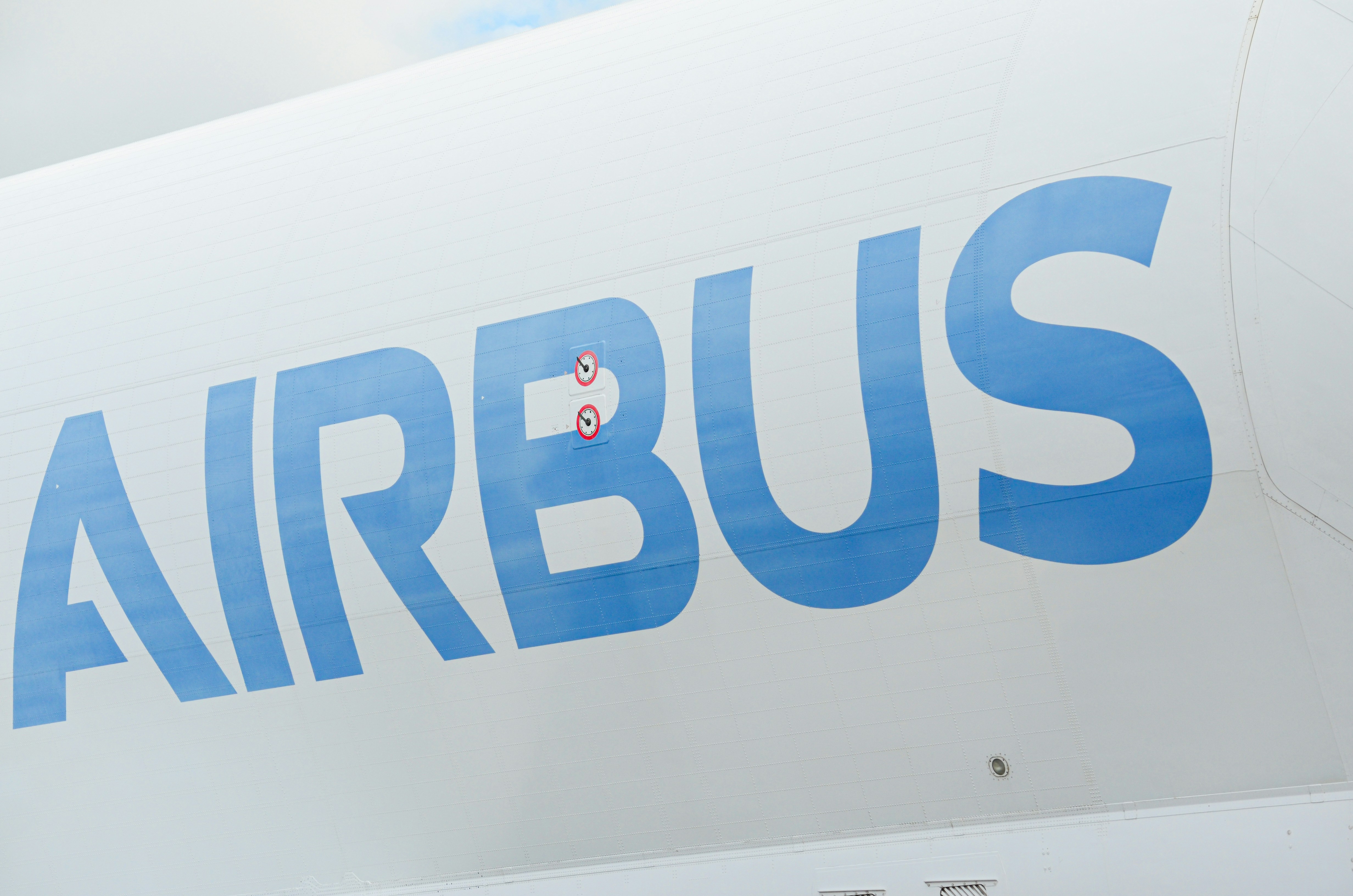 The airbus logo is visible on a white aircraft fuselage