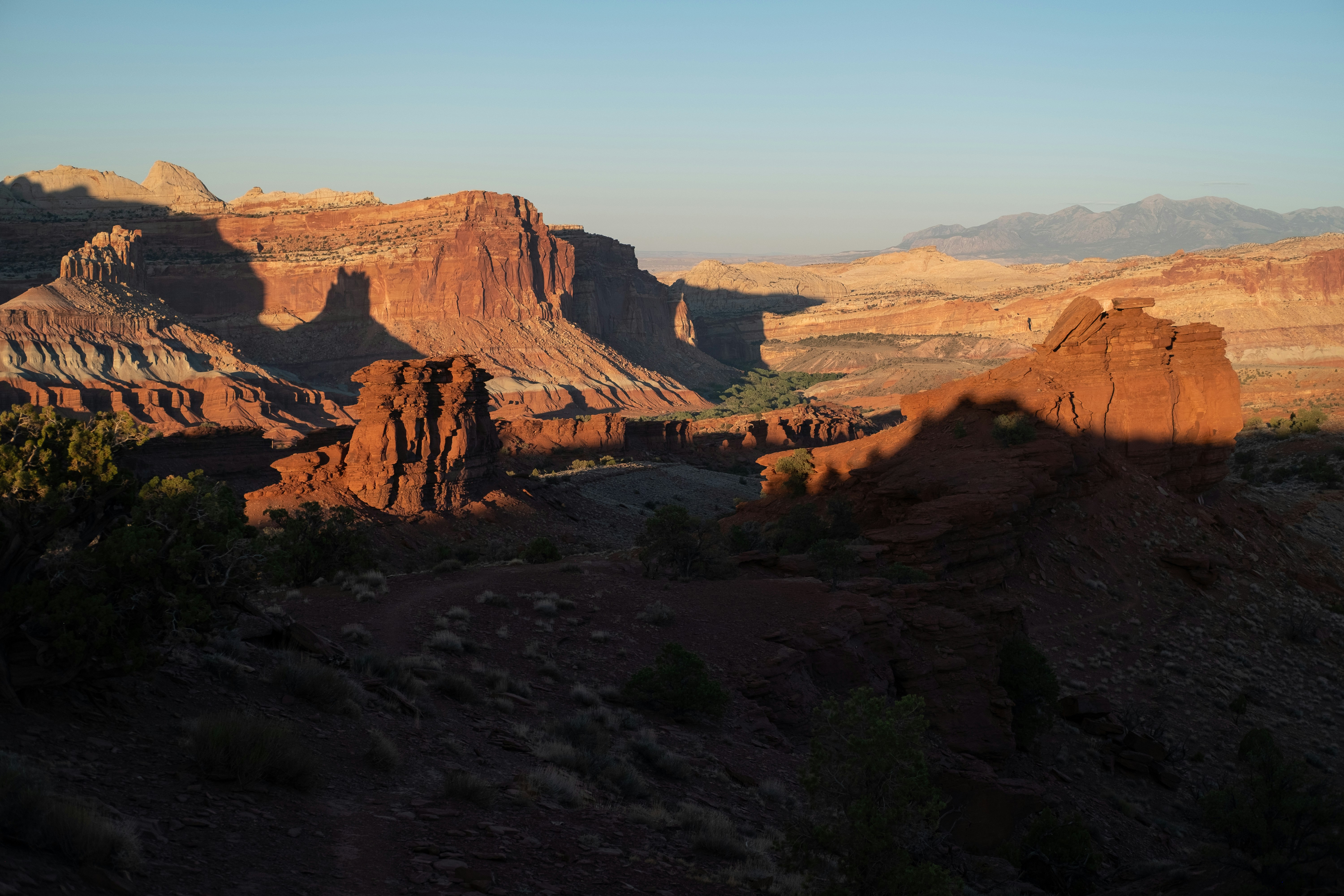 Red rock desert landscape bathed in warm sunlight