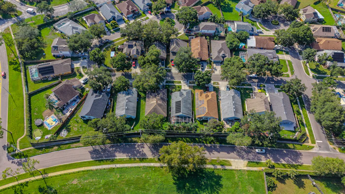 Aerial view of a suburban neighbourhood of houses among trees