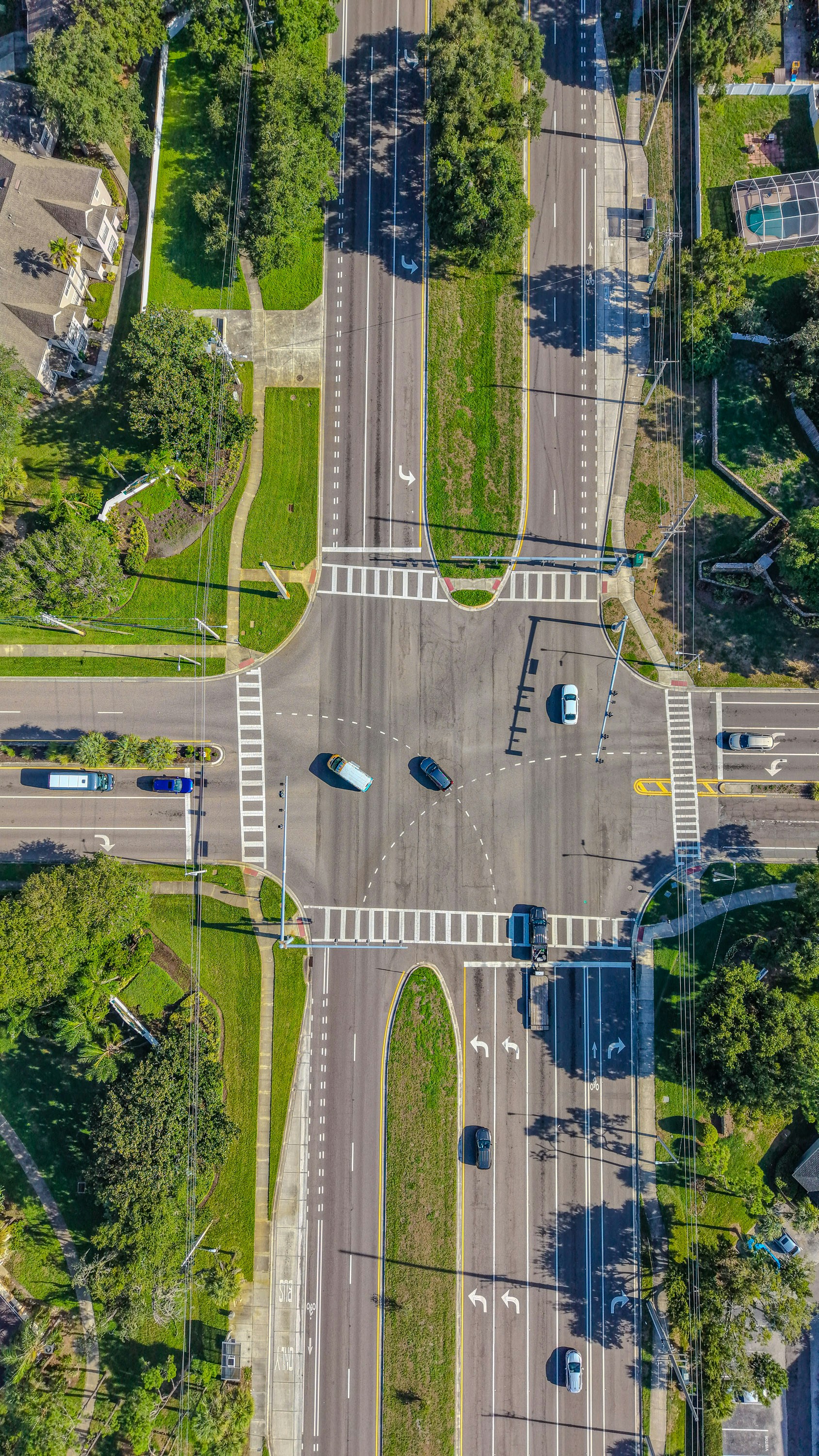 Overhead view of a busy road intersection with vehicles