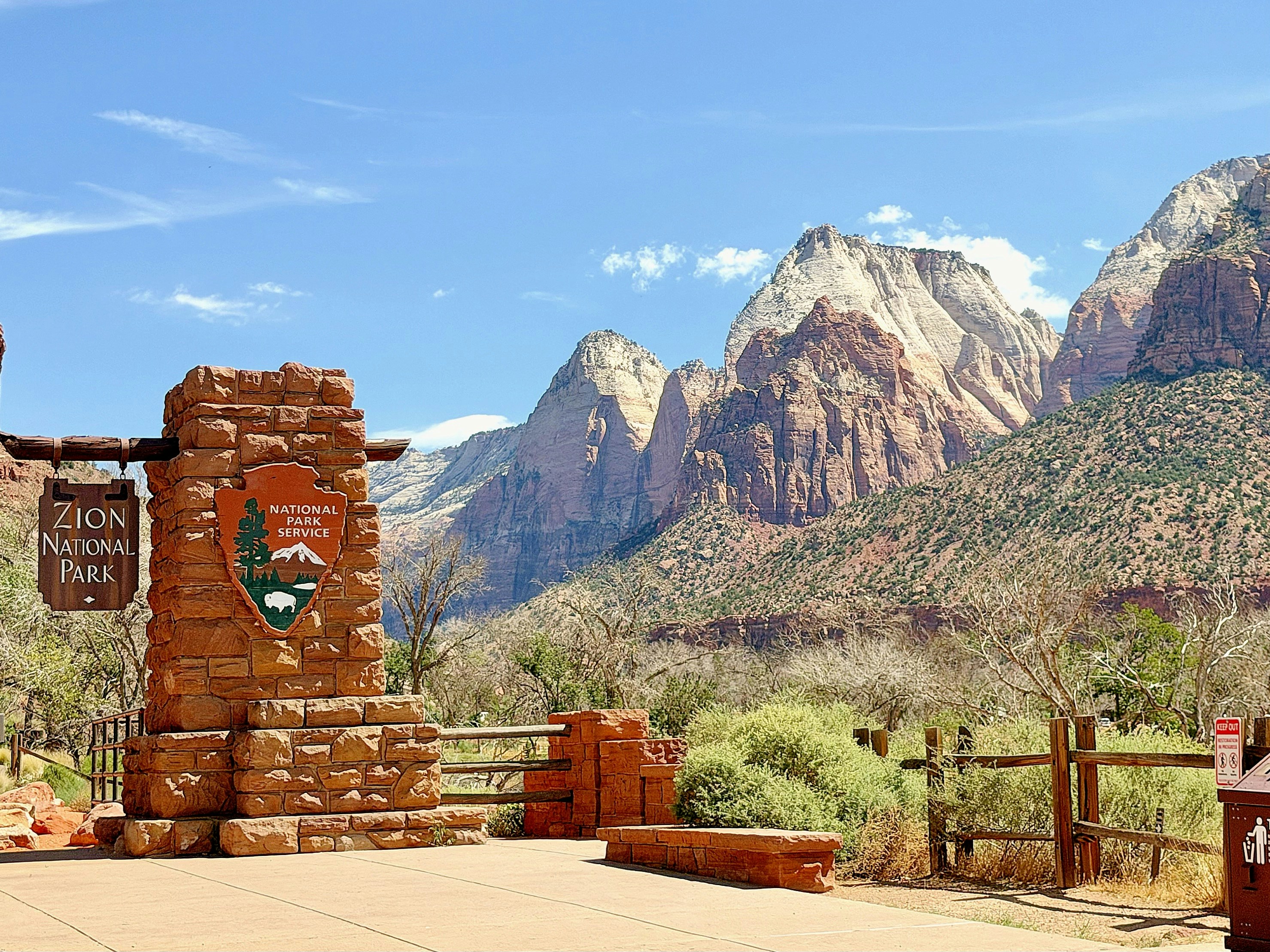 Zion national park entrance sign against majestic mountains