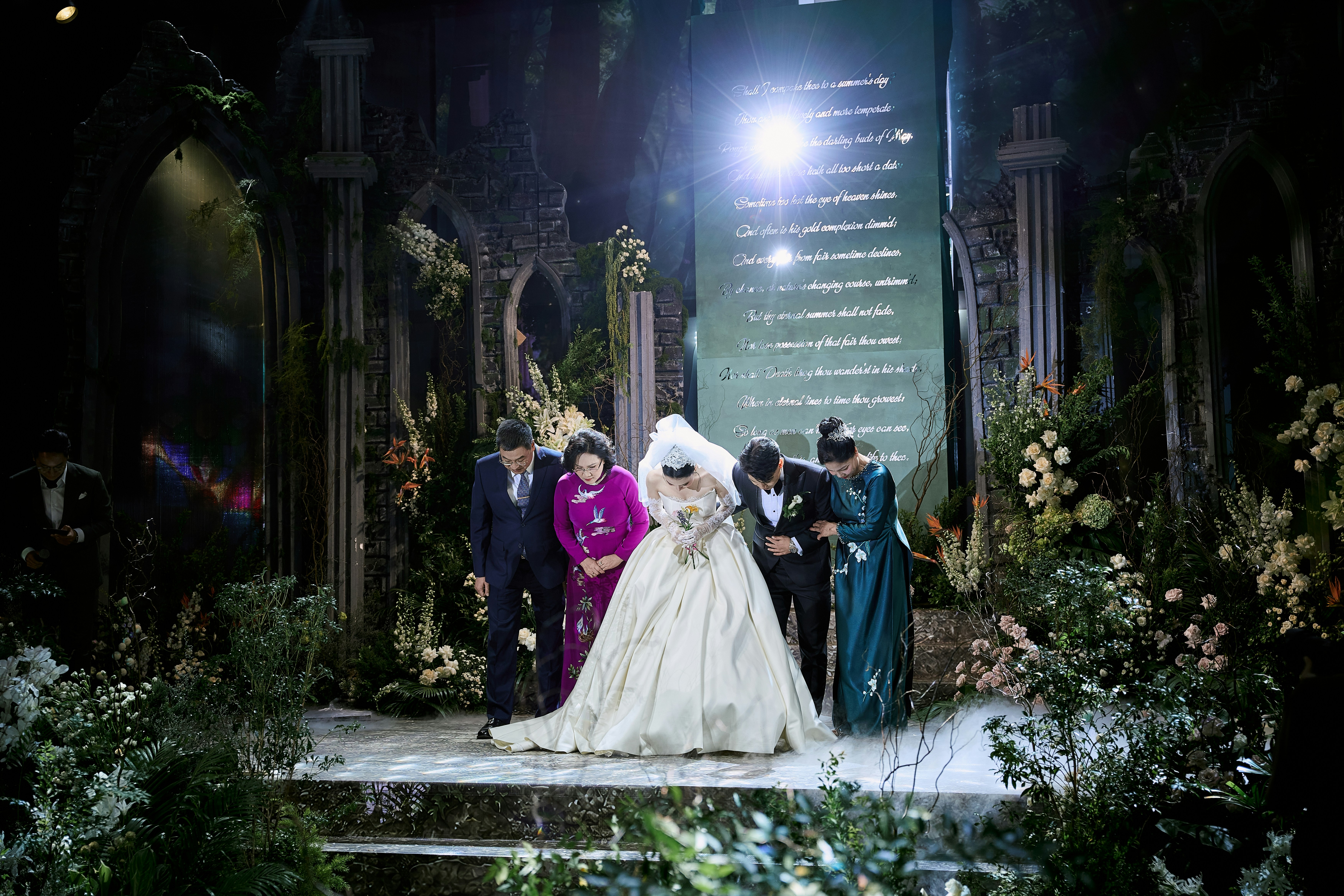 Elegant bride bowing at a beautifully decorated wedding event