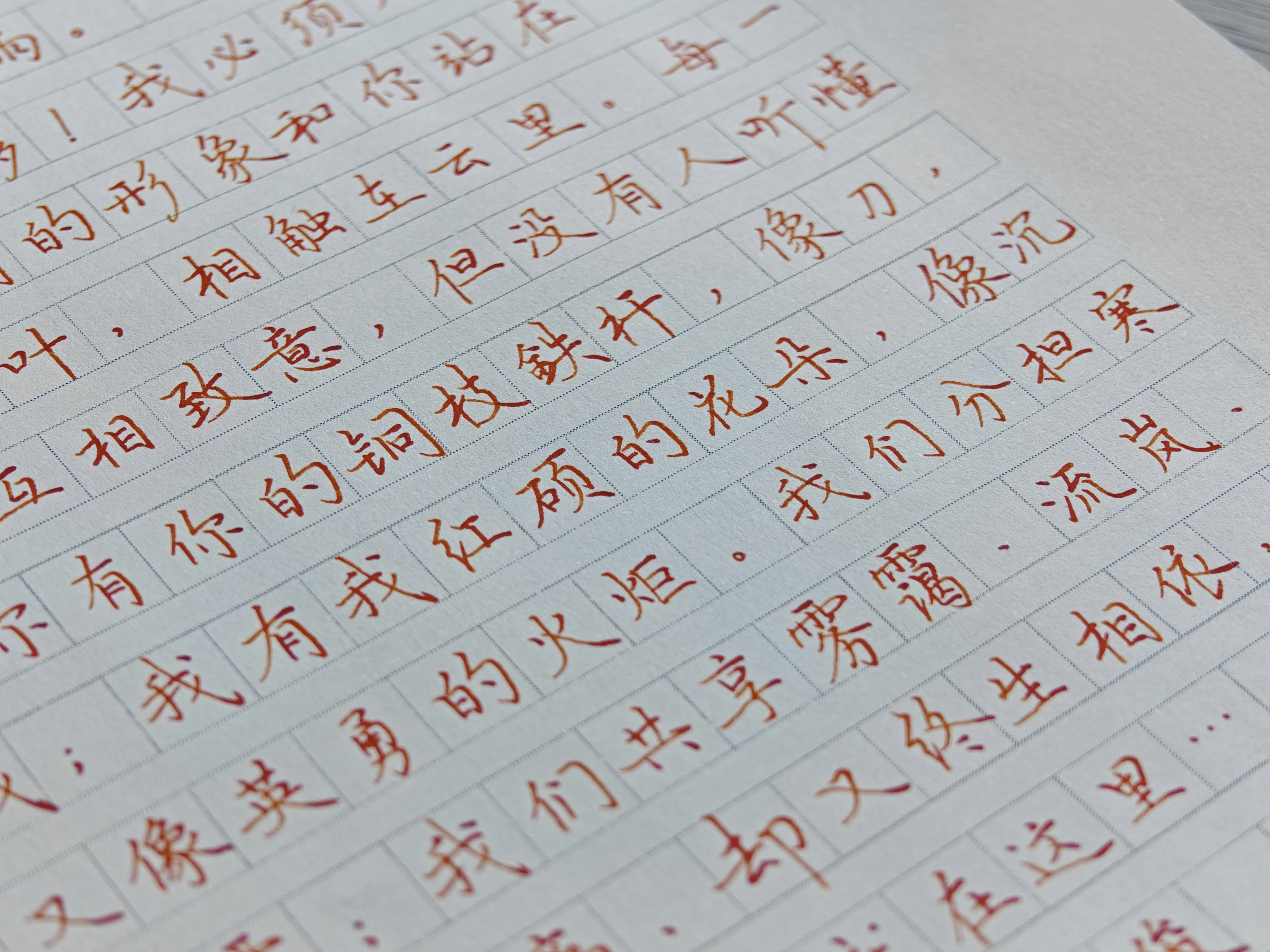 Red chinese characters handwritten on white paper