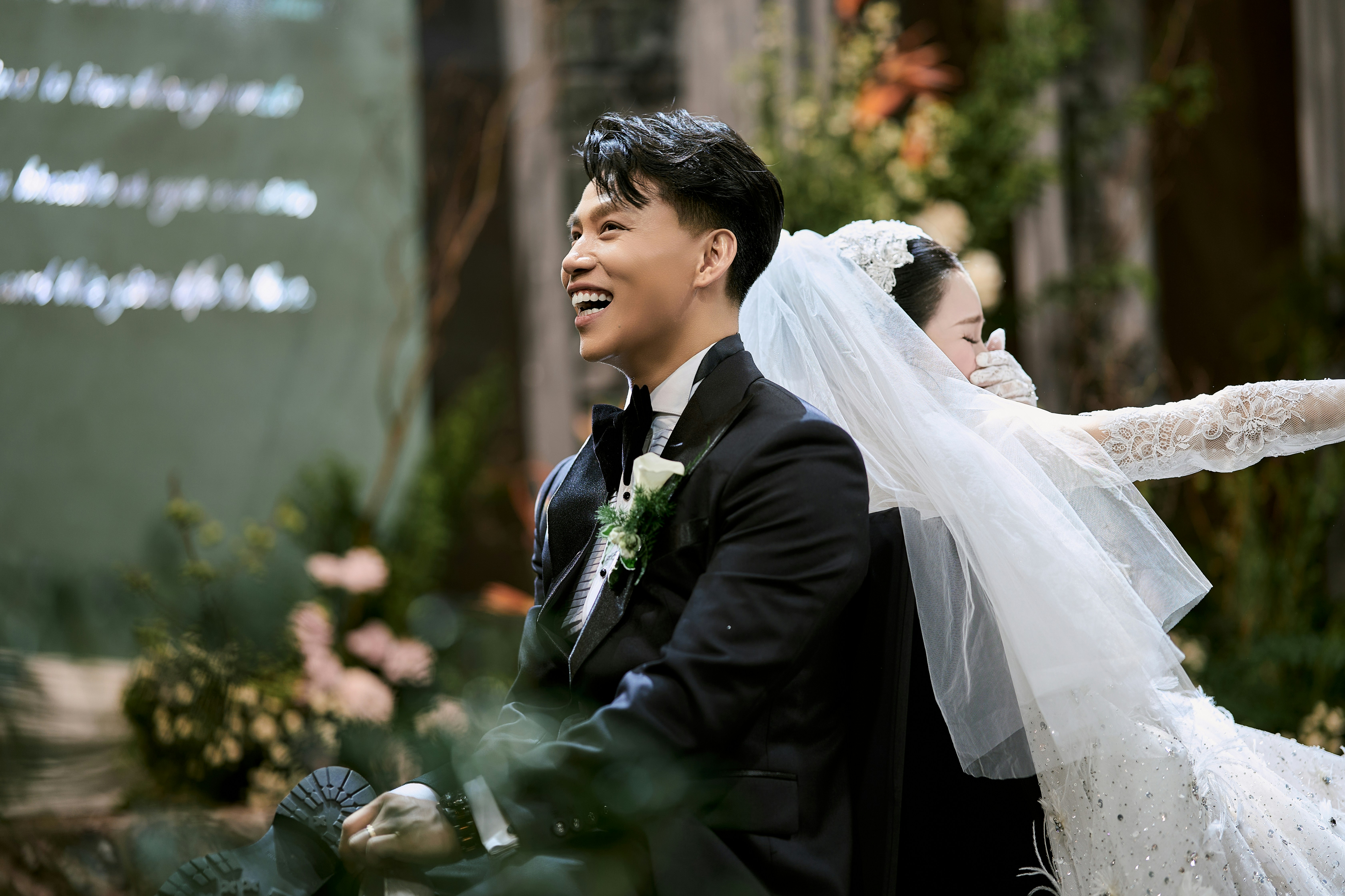 A smiling groom and bride at their wedding ceremony