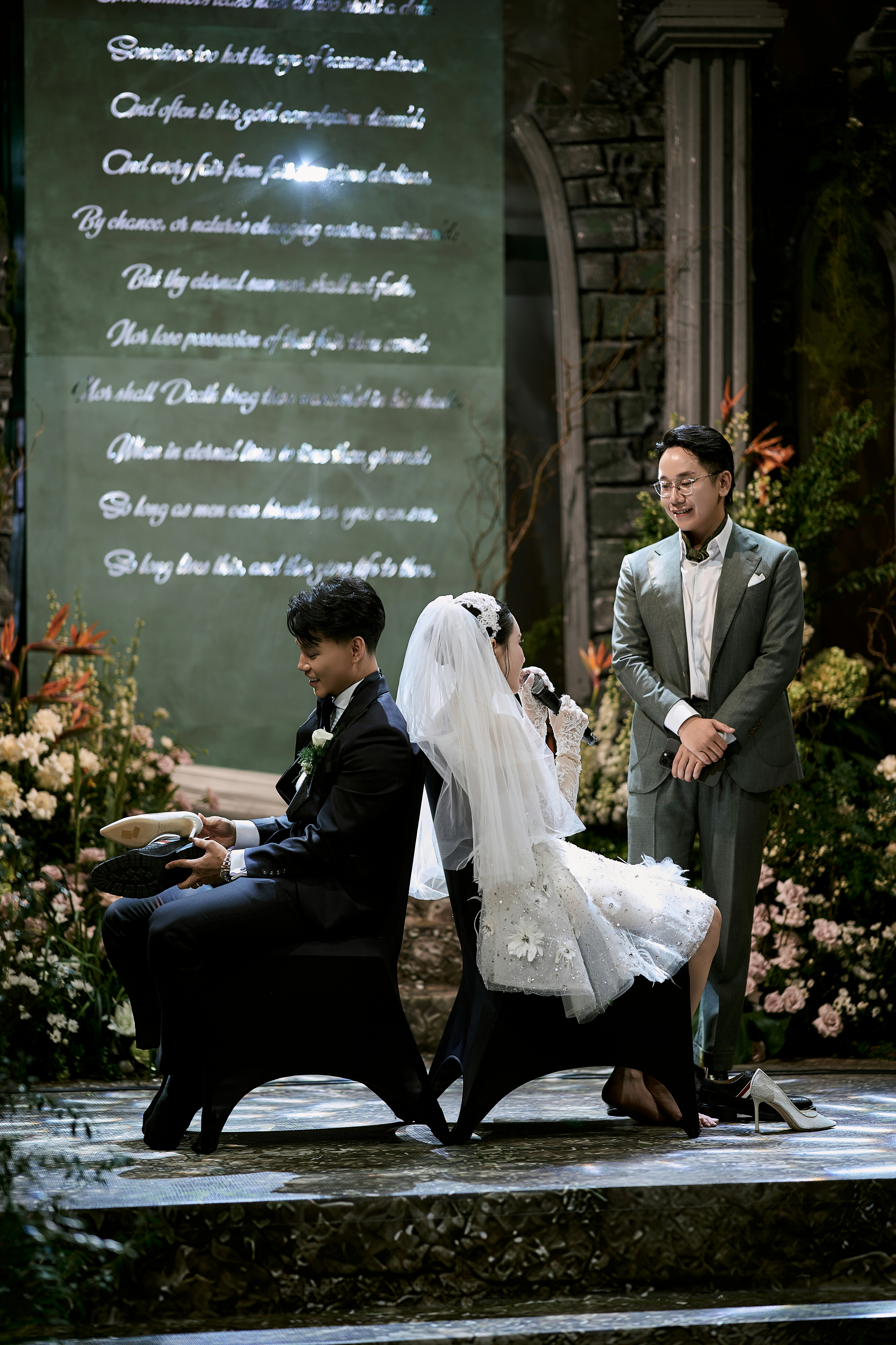 Bride and groom sitting back-to-back at their wedding ceremony
