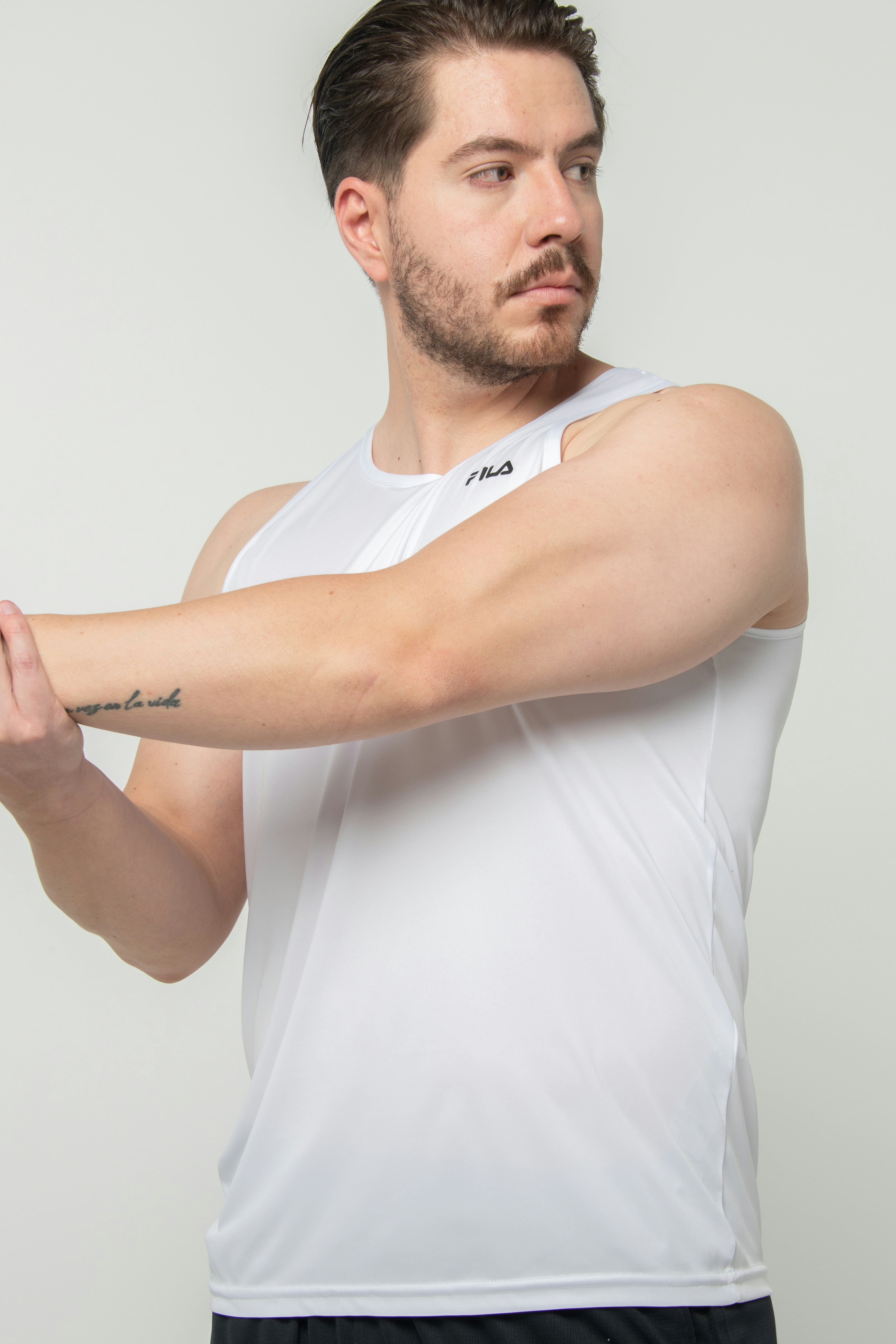 Athletic man stretching before training