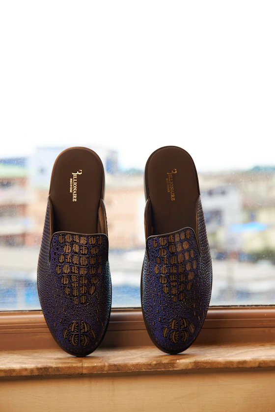 A pair of textured slip-on mules