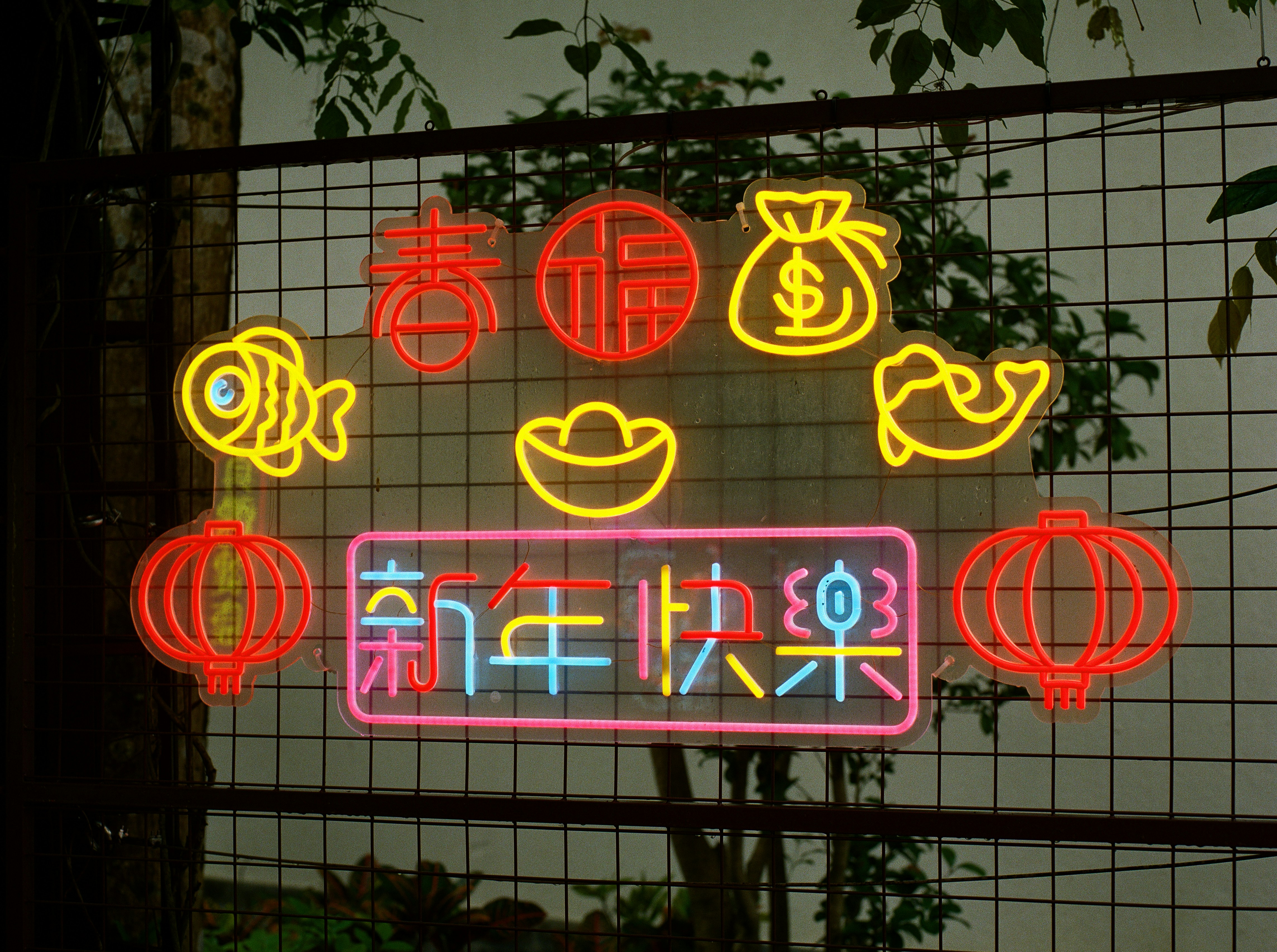 Colorful neon signs and lanterns celebrate chinese new year