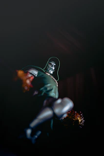 Dr. doom action figure in dark with fiery effects